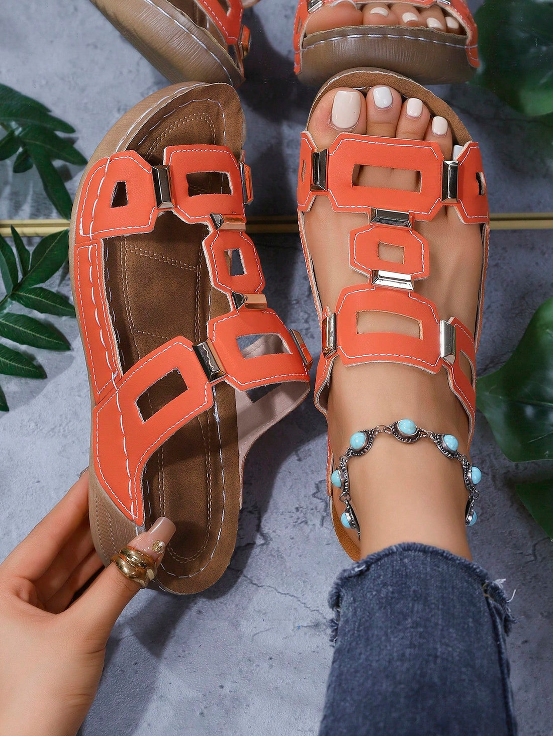 Women's open-toe wedge slide sandals with studded hollow-out upper, cross-over straps, buckle closure, and thick soft sole