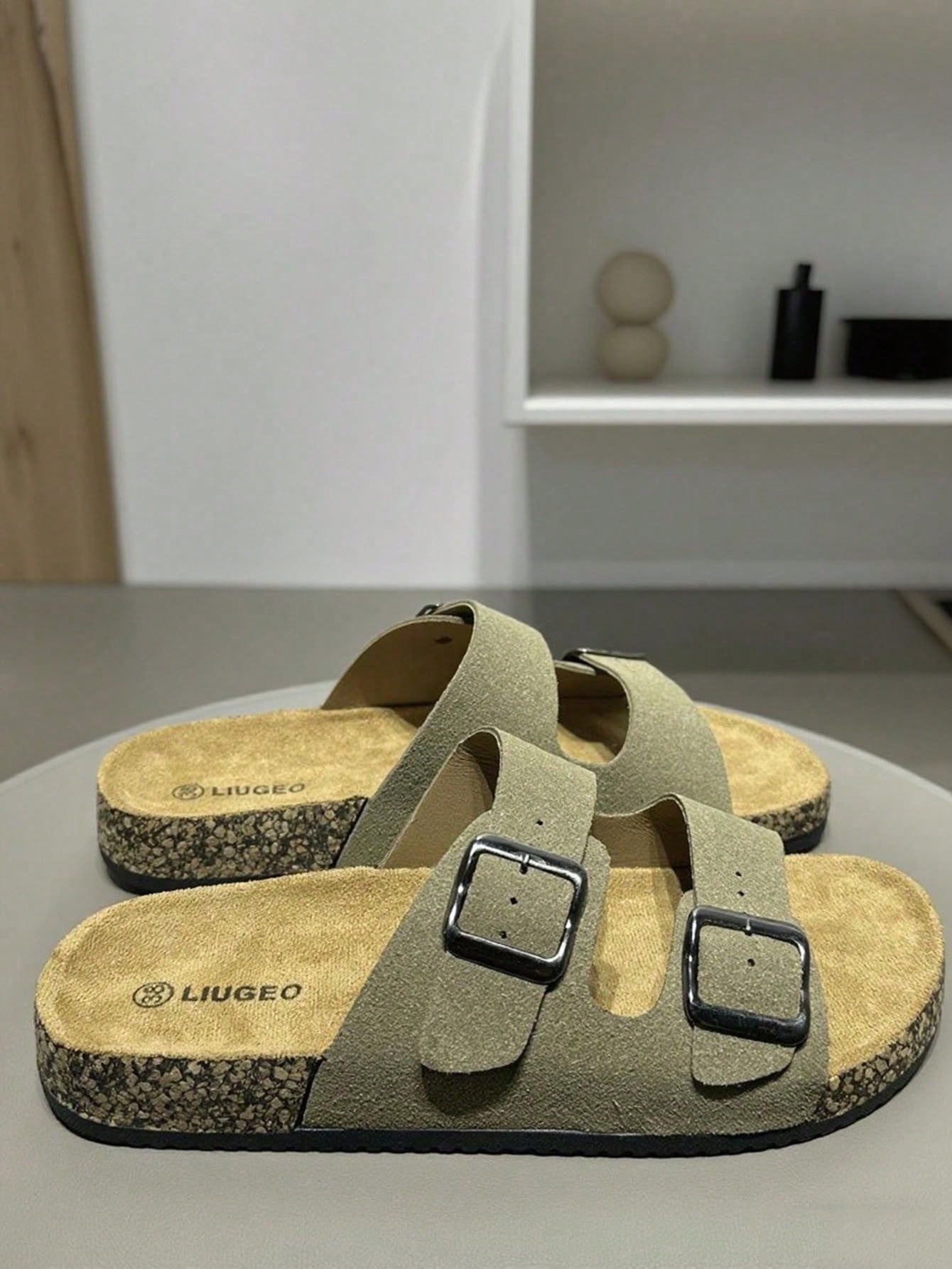Open-toe footbed slip-on mule sandals with buckle detail and cork-style sole, flat heel design for casual summer home and outdoor walking.