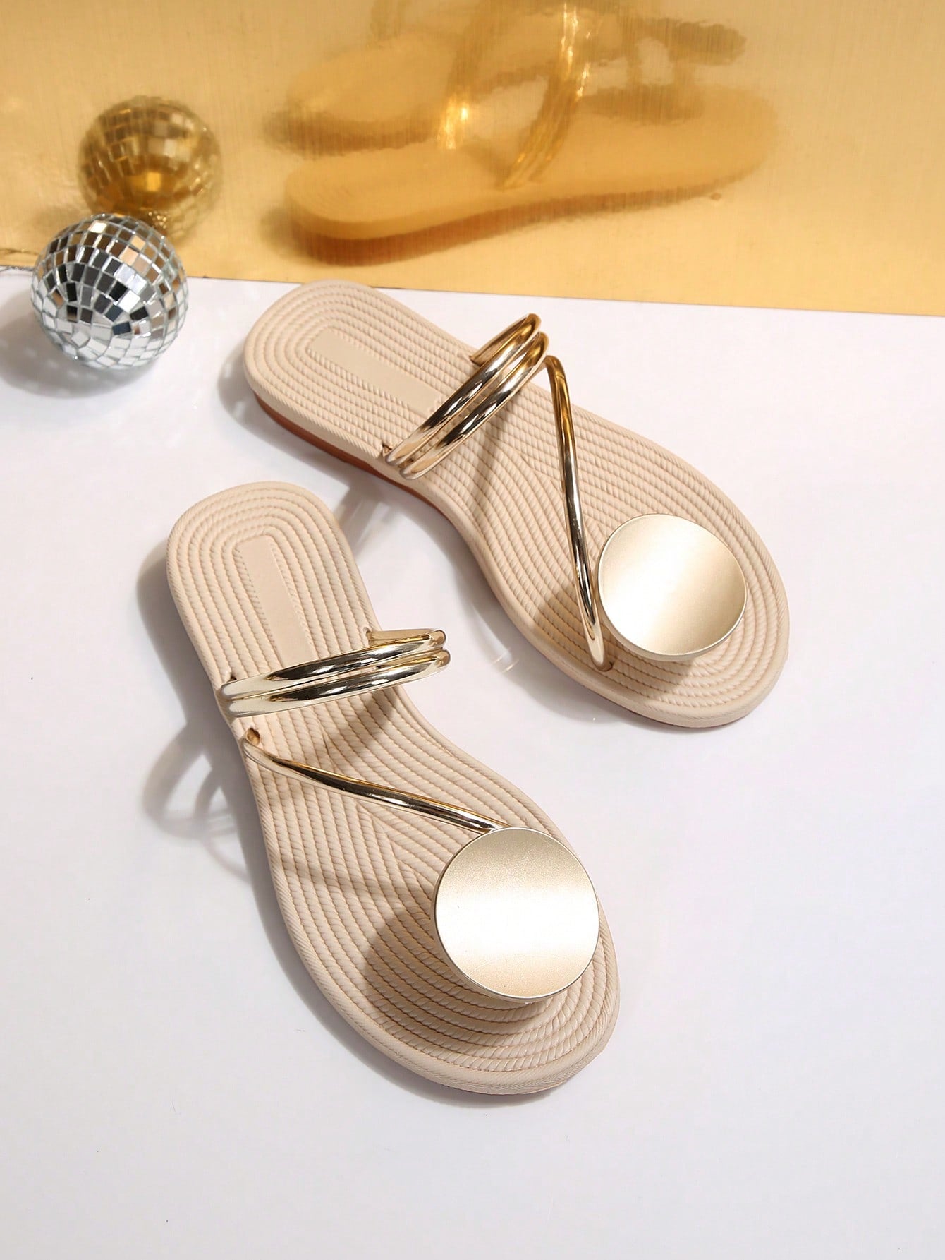 Women's flat slide sandals with crystal-style rhinestone and bow embellishments, toe post front, and beach-ready slip-on design.