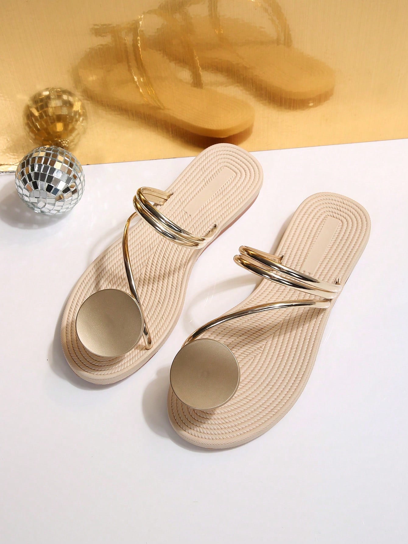 Women's flat slide sandals with crystal-style rhinestone and bow embellishments, toe post front, and beach-ready slip-on design.
