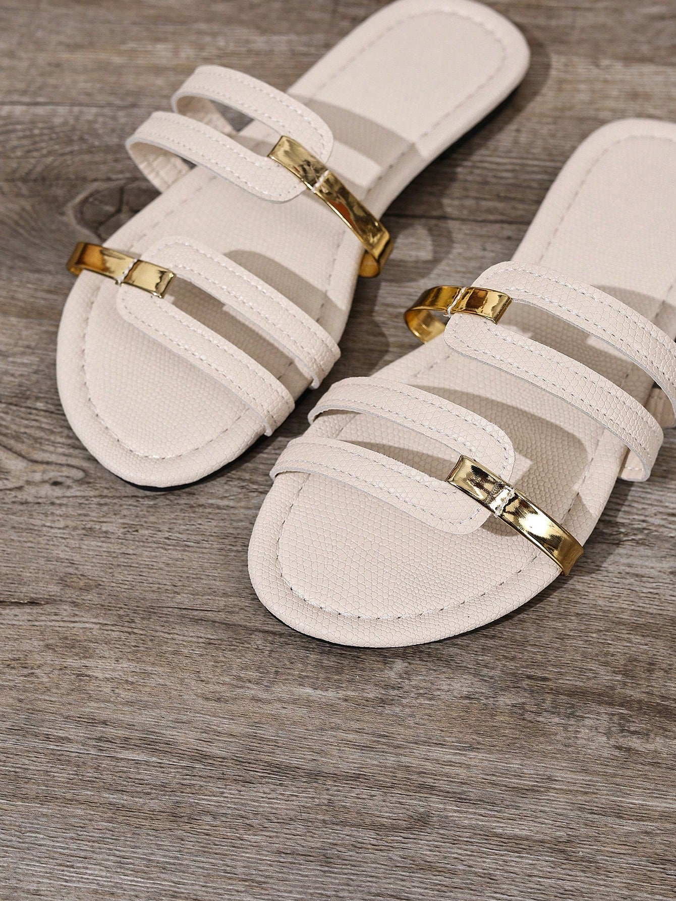 Women's yellow open-toe flat slide sandals featuring a cut-out design and textured plain pattern for casual beach and daily wear.