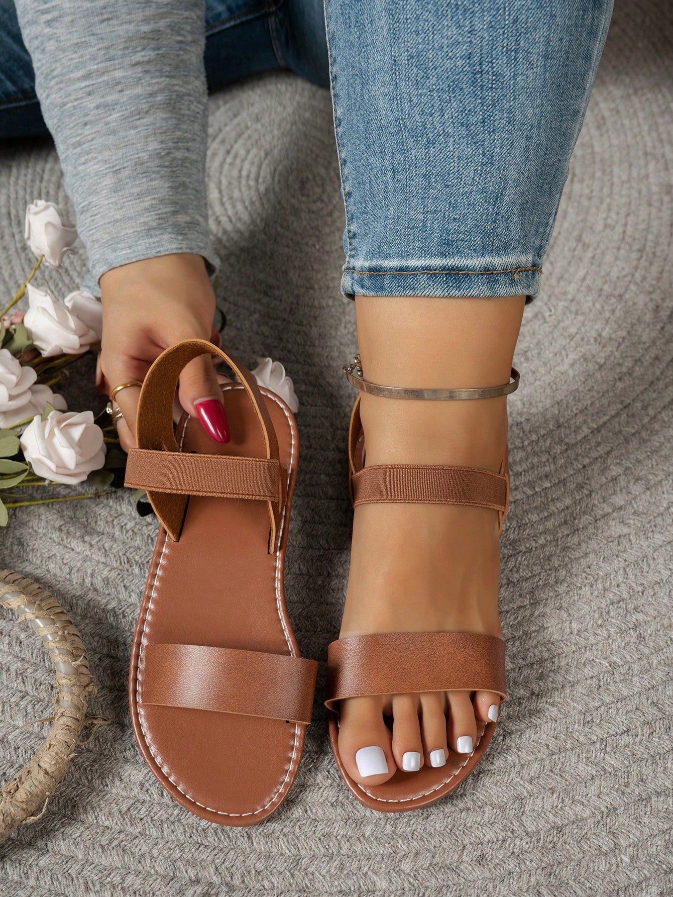 Women's wide fit flat gladiator sandals with woven textured straps, open toe, slip-on design, and lettuce trim detail.
