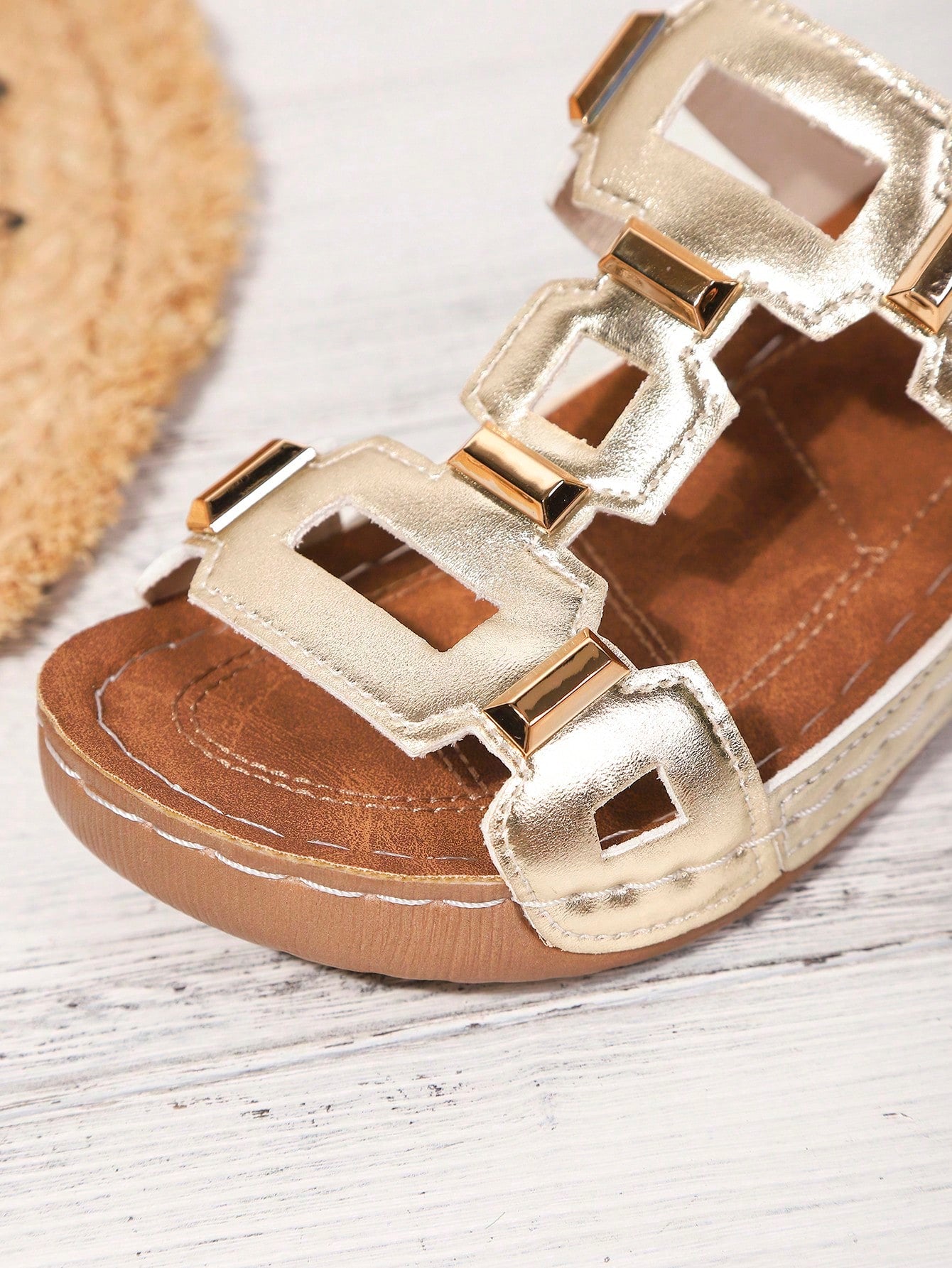 Women's open-toe wedge slide sandals with studded hollow-out upper, cross-over straps, buckle closure, and thick soft sole