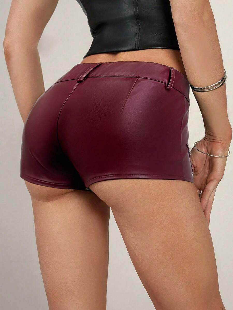 Women's Y2K low rise PU leather hot pants with star rivet details, zipper fly, button closure, and mini skinny fit