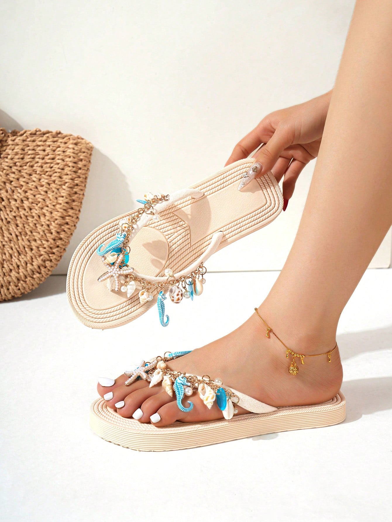 Handmade women’s beach flip flop sandals with shell and starfish rhinestone decorated woven straps, flat thong style, and lightweight non-slip sole.