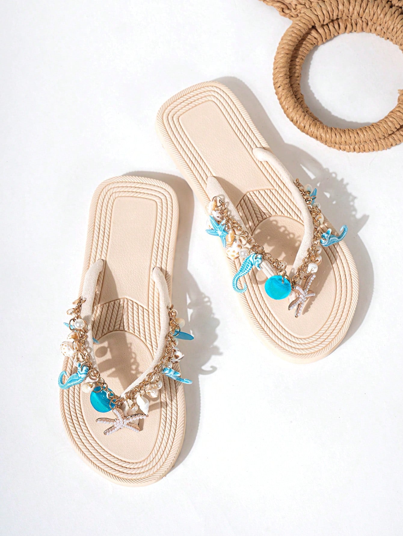 Handmade women’s beach flip flop sandals with shell and starfish rhinestone decorated woven straps, flat thong style, and lightweight non-slip sole.