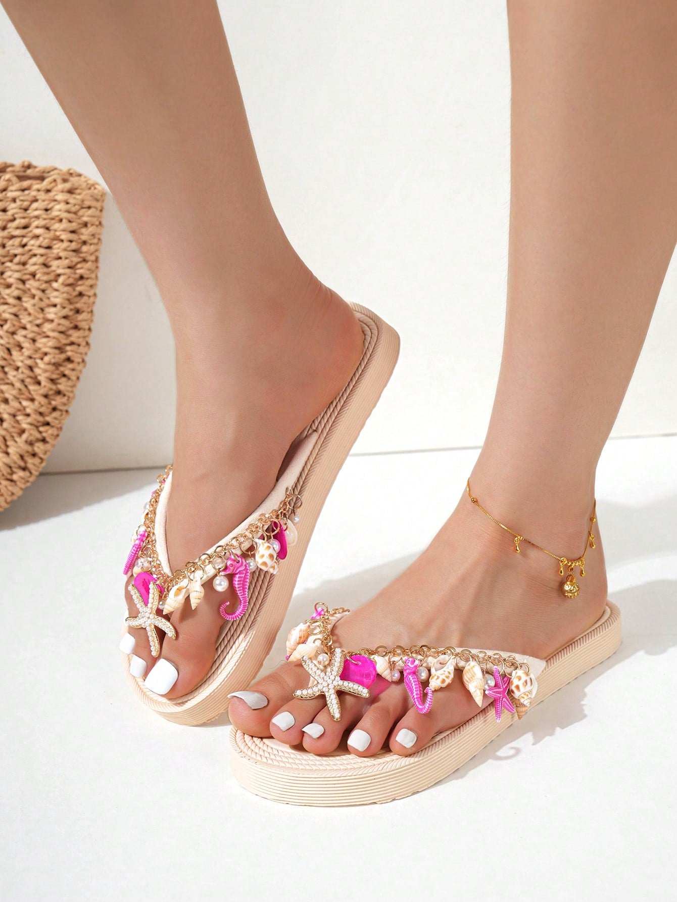 Handmade women’s beach flip flop sandals with shell and starfish rhinestone decorated woven straps, flat thong style, and lightweight non-slip sole.