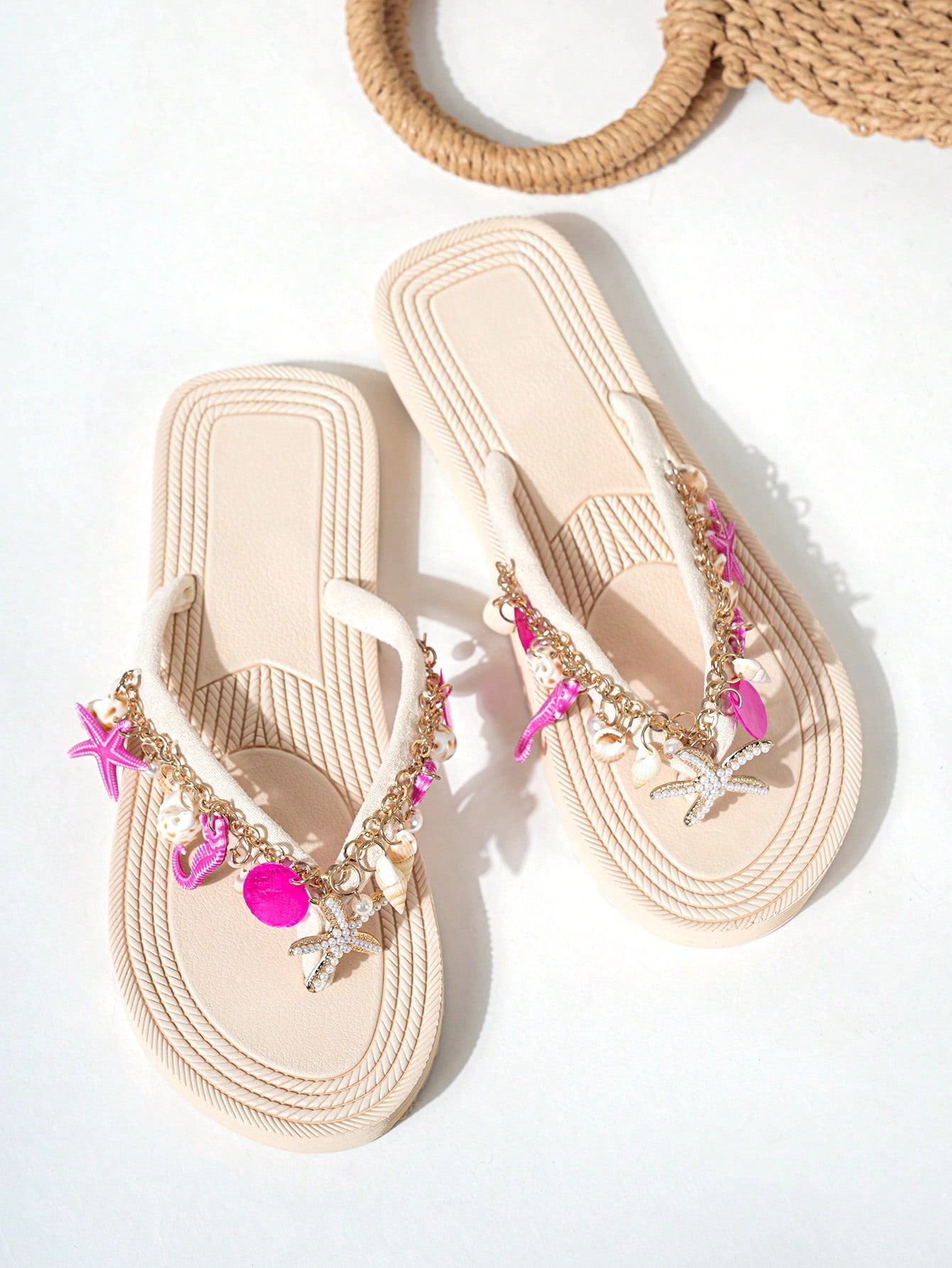 Handmade women’s beach flip flop sandals with shell and starfish rhinestone decorated woven straps, flat thong style, and lightweight non-slip sole.