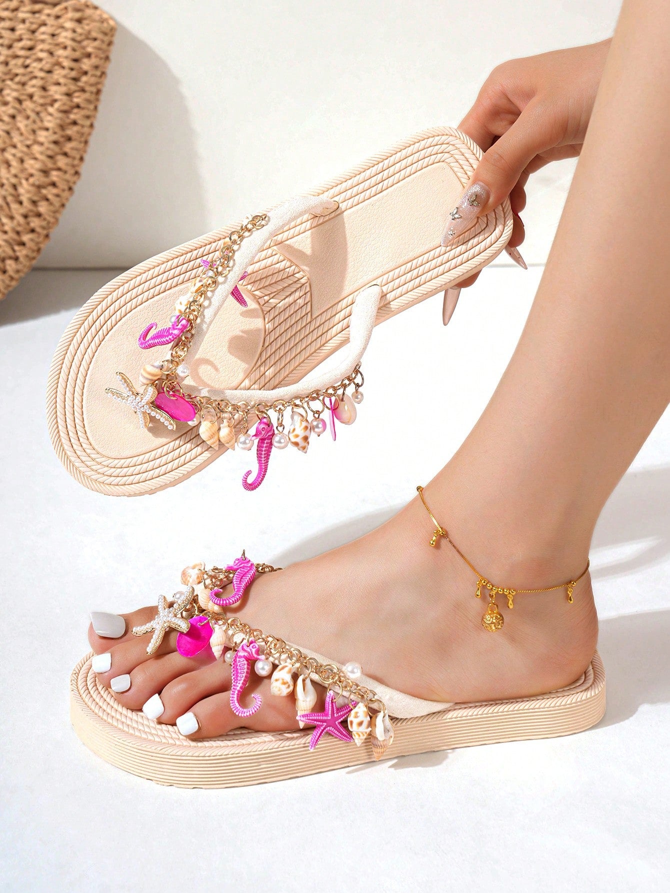 Handmade women’s beach flip flop sandals with shell and starfish rhinestone decorated woven straps, flat thong style, and lightweight non-slip sole.