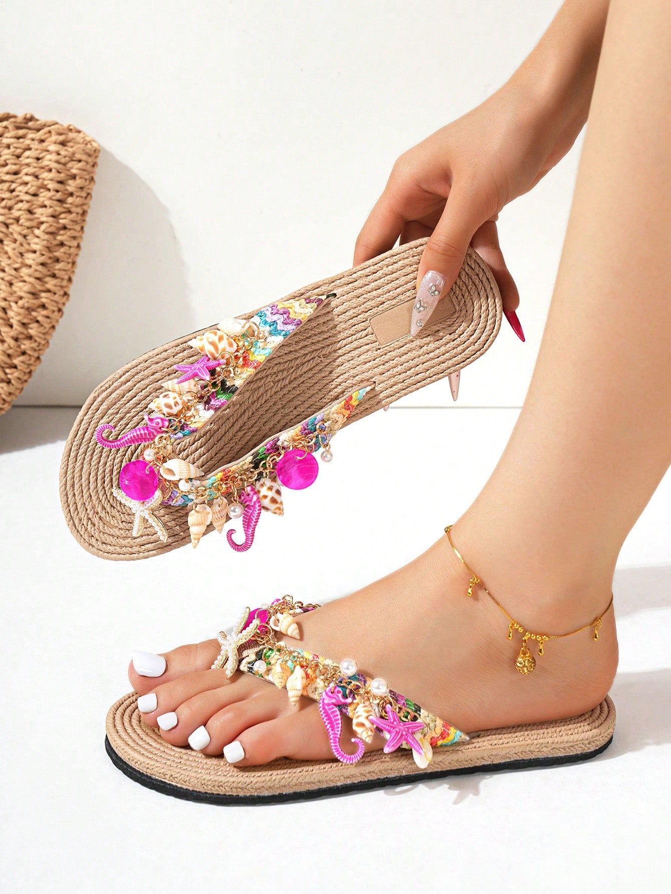 Handmade women’s beach flip flop sandals with shell and starfish rhinestone decorated woven straps, flat thong style, and lightweight non-slip sole.