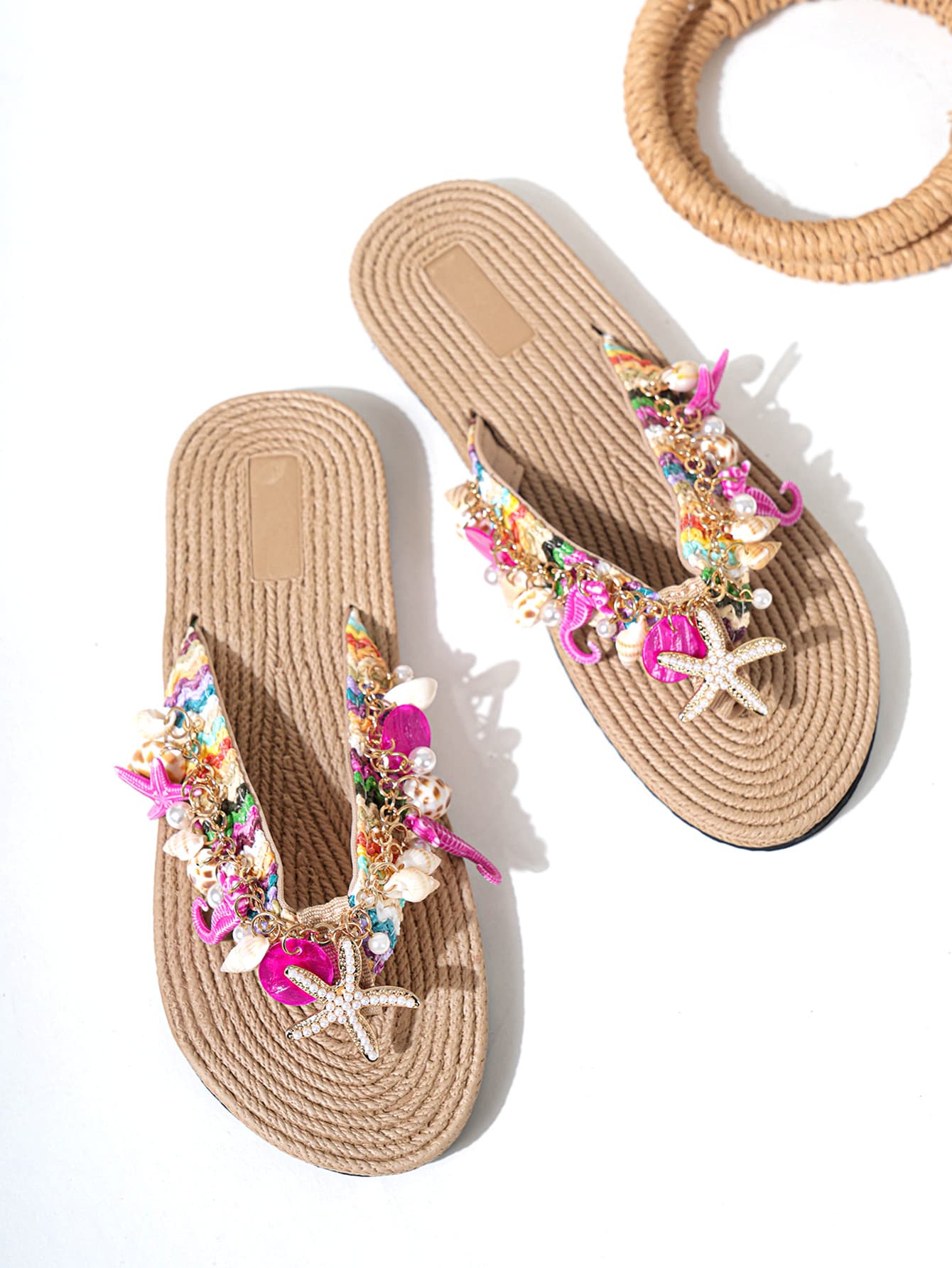 Handmade women’s beach flip flop sandals with shell and starfish rhinestone decorated woven straps, flat thong style, and lightweight non-slip sole.