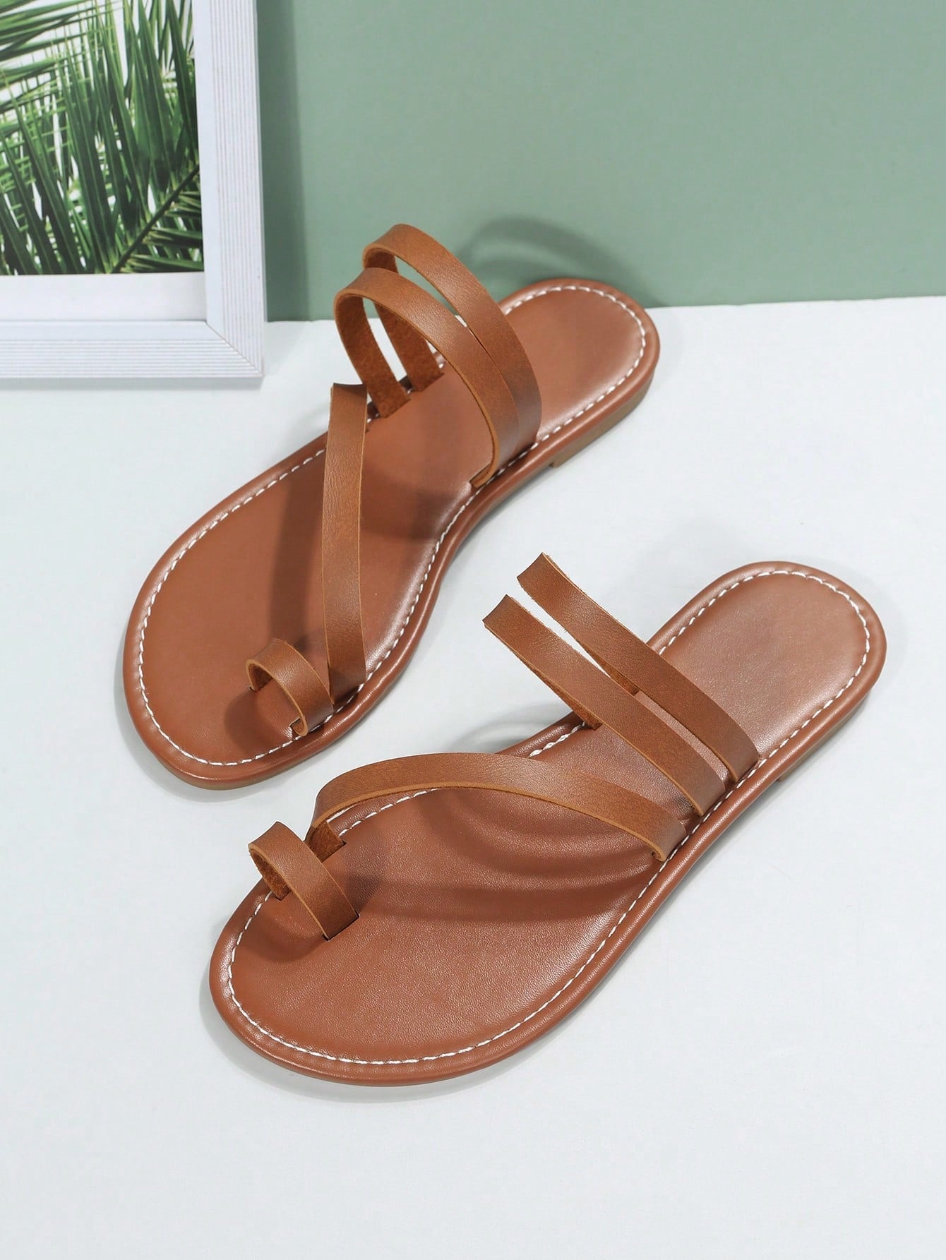 Plus size women's flat slide sandals featuring a toe post and hollow out design, casual outdoor vacation style summer footwear.