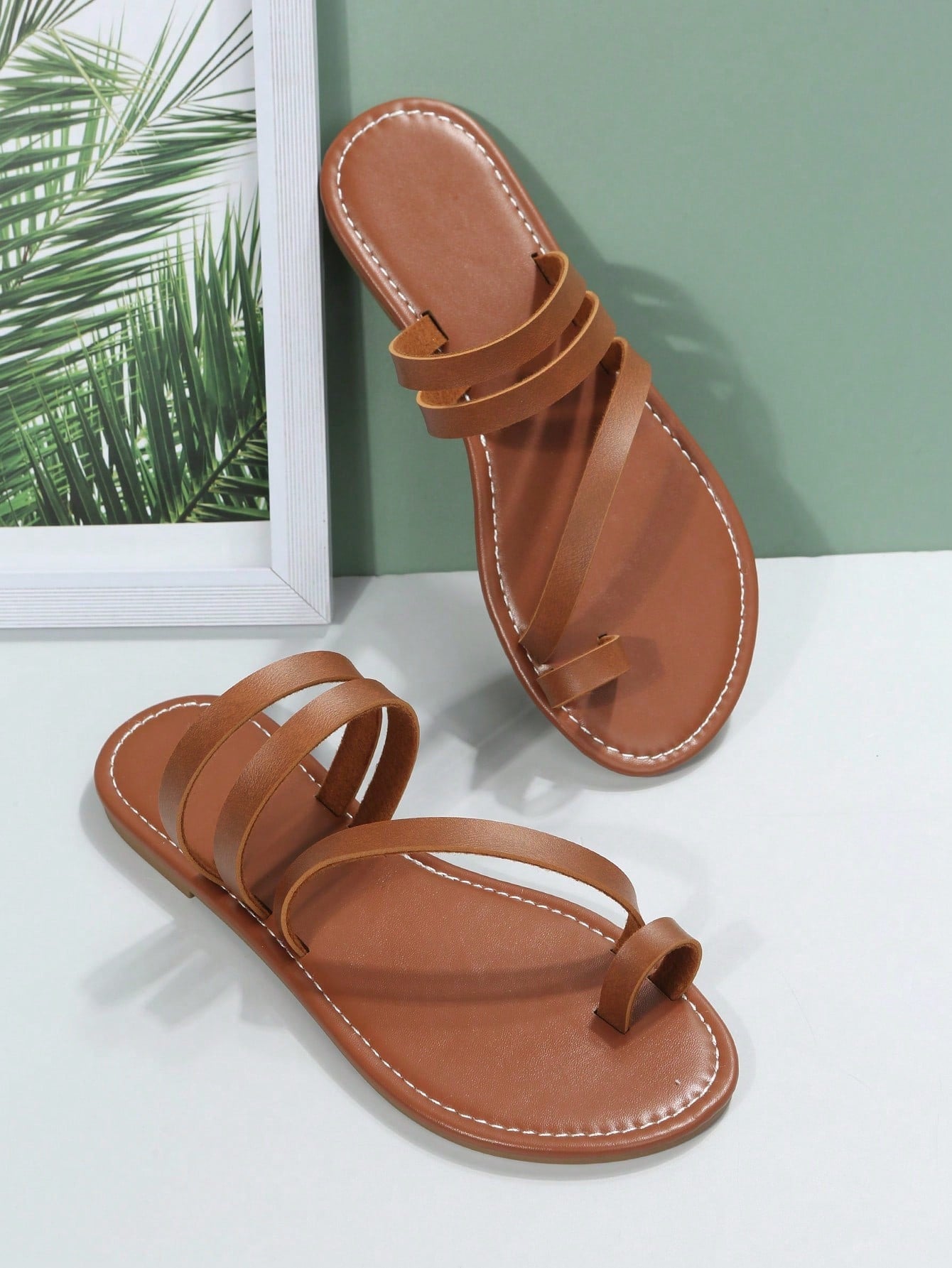 Plus size women's flat slide sandals featuring a toe post and hollow out design, casual outdoor vacation style summer footwear.