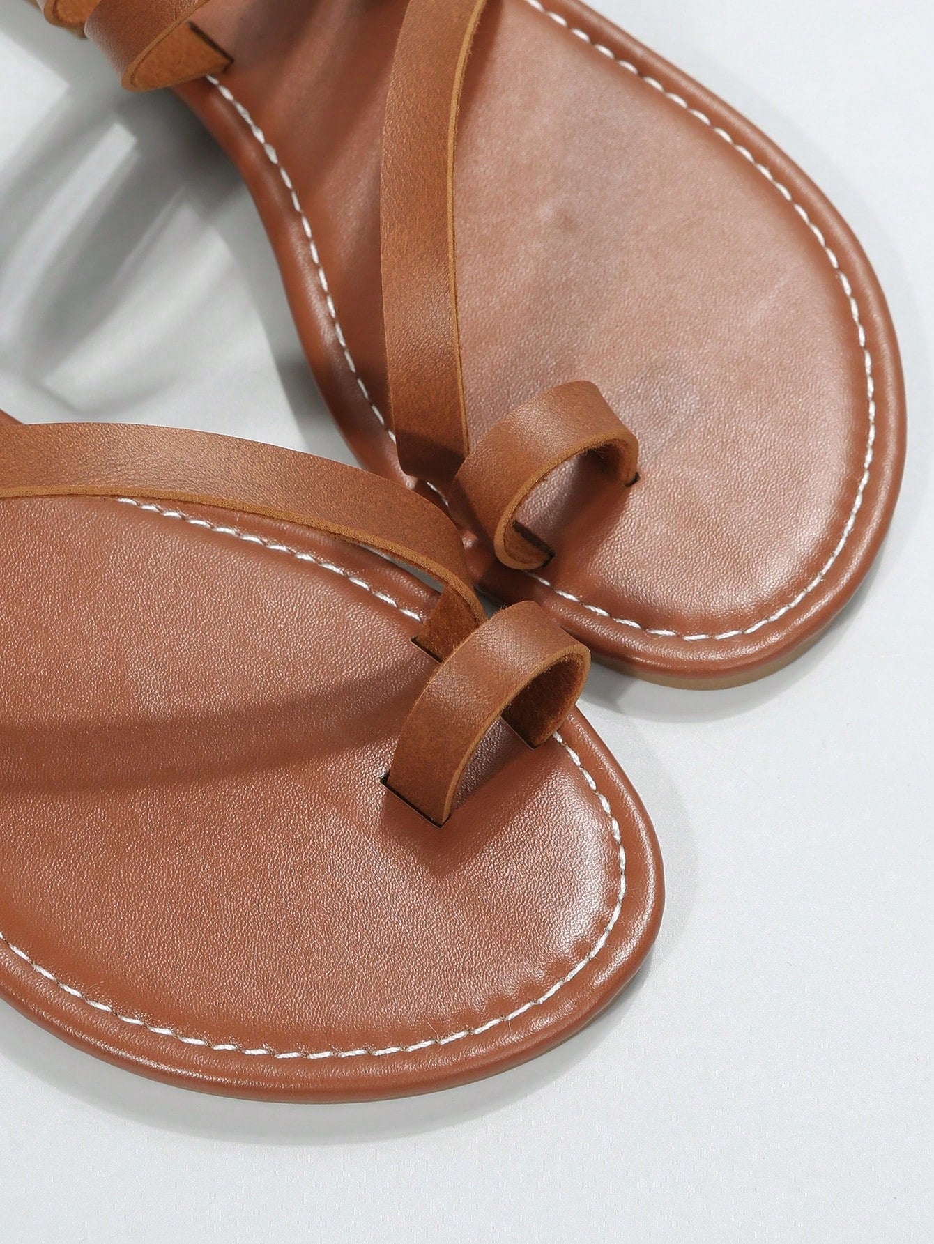 Plus size women's flat slide sandals featuring a toe post and hollow out design, casual outdoor vacation style summer footwear.