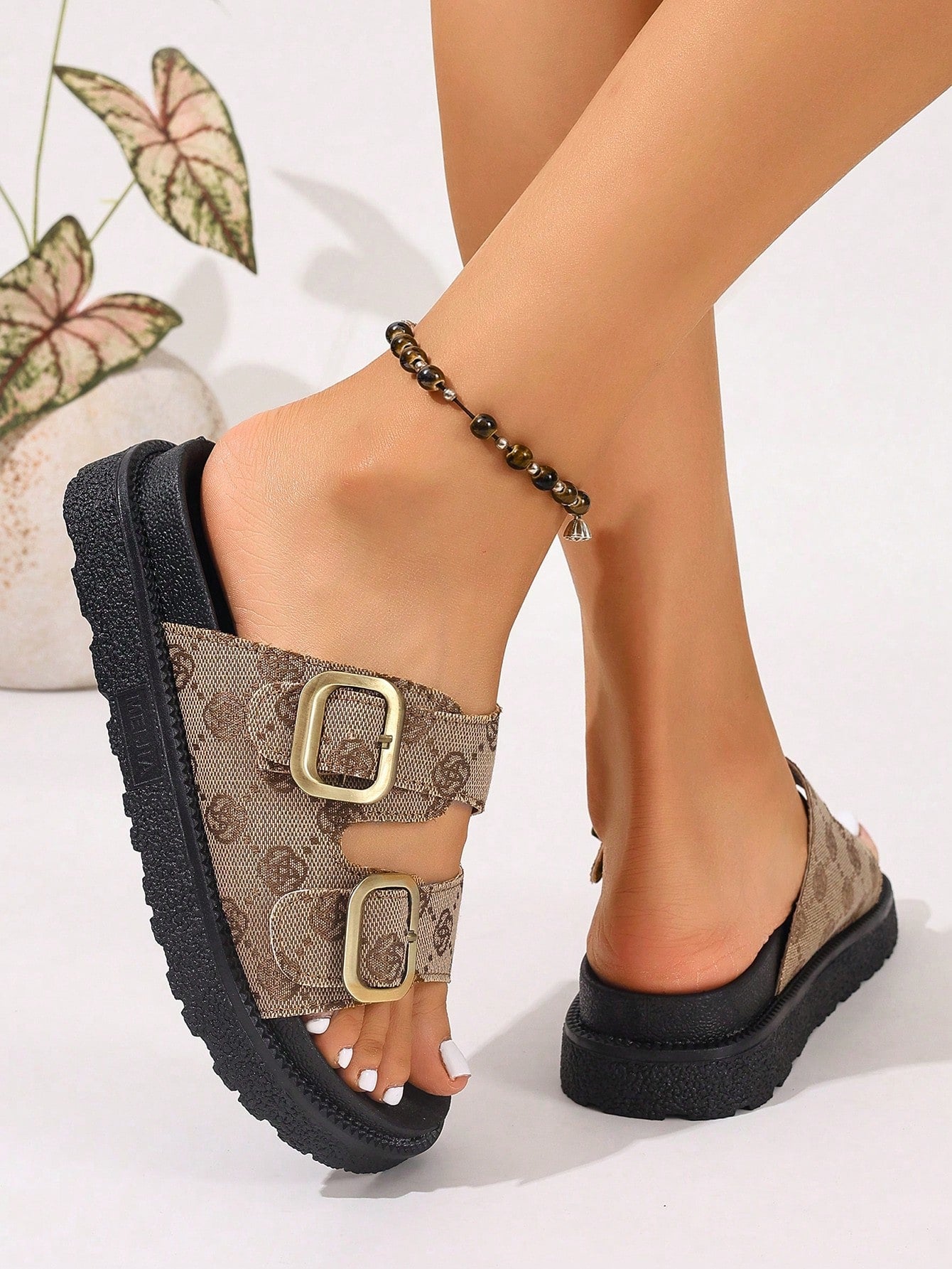 Plus size women's wedge platform slide sandals with open toe, buckle detail, and low heel slip-on design.