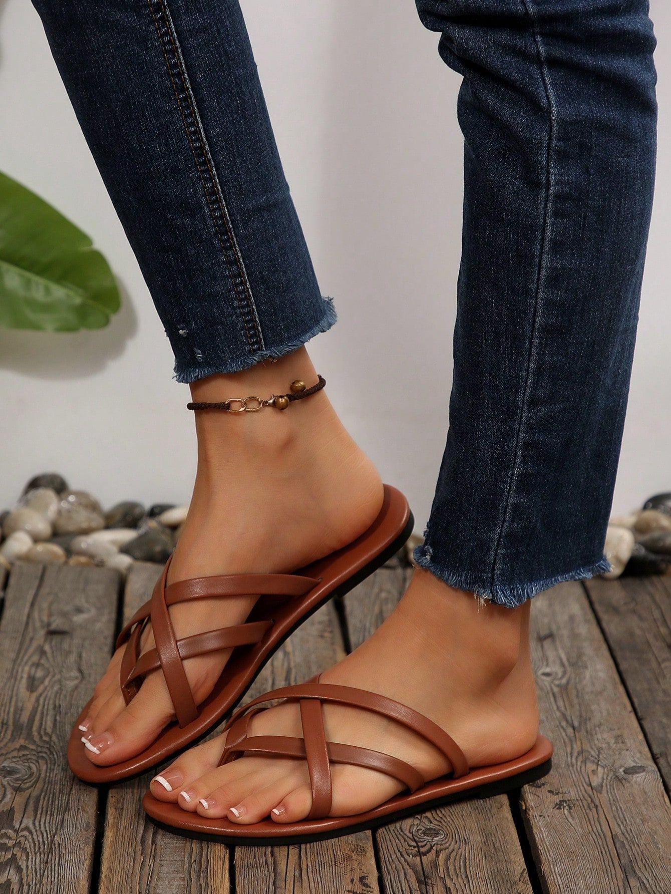 Women's chocolate brown flat flip flop sandals featuring a toe-post thong style and braided detail, suitable for casual indoor and outdoor wear.