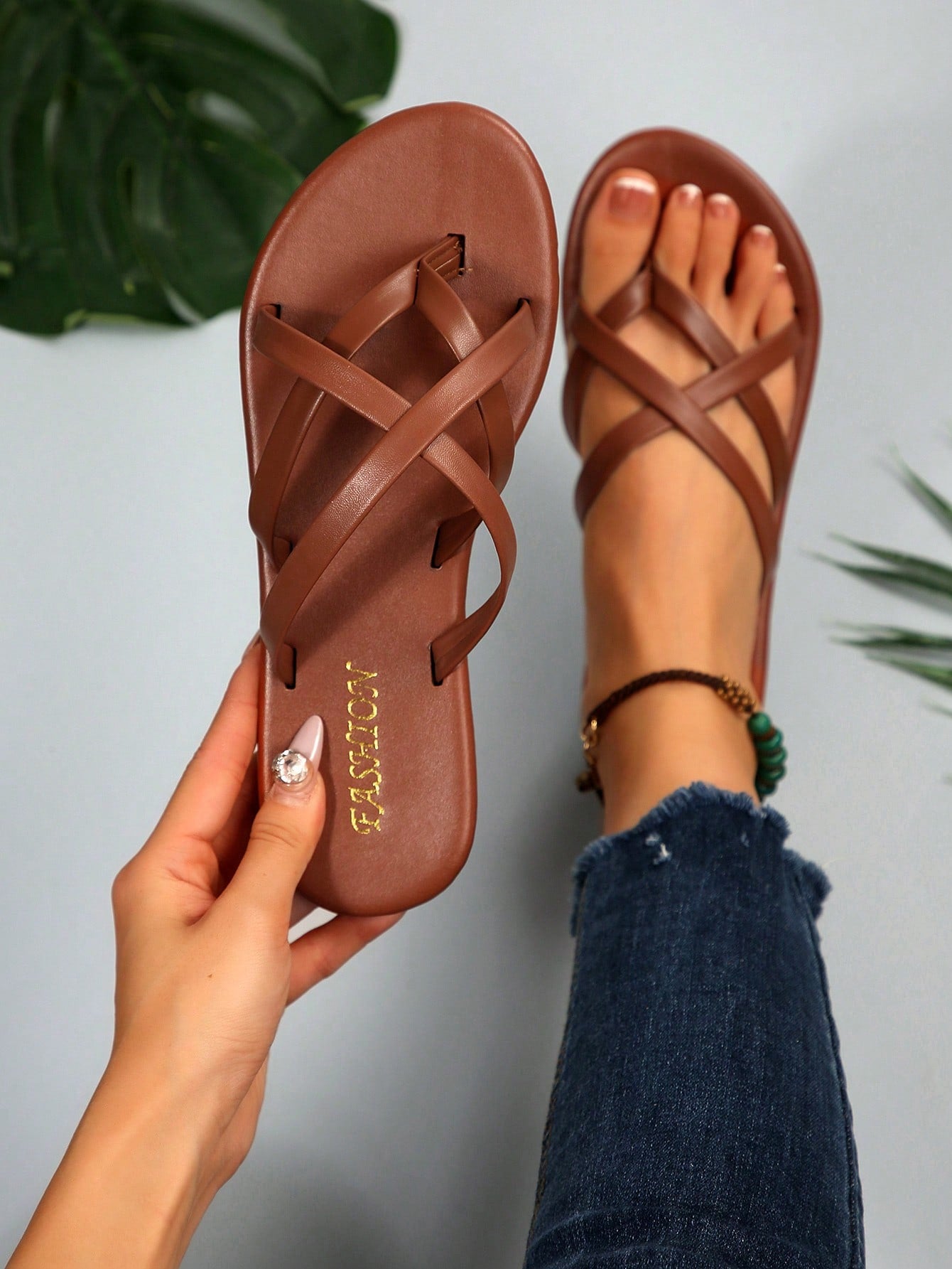 Women's chocolate brown flat flip flop sandals featuring a toe-post thong style and braided detail, suitable for casual indoor and outdoor wear.