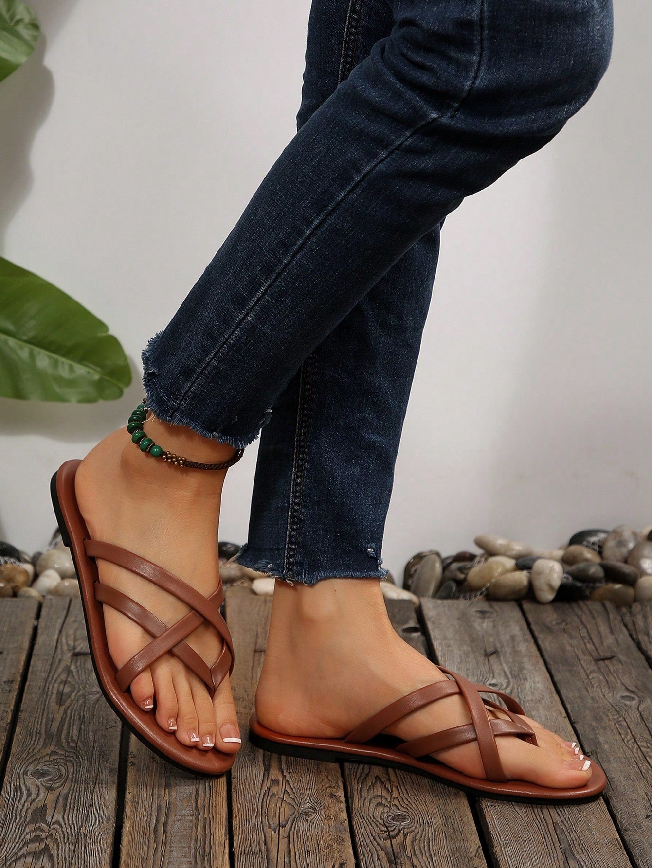 Women's chocolate brown flat flip flop sandals featuring a toe-post thong style and braided detail, suitable for casual indoor and outdoor wear.