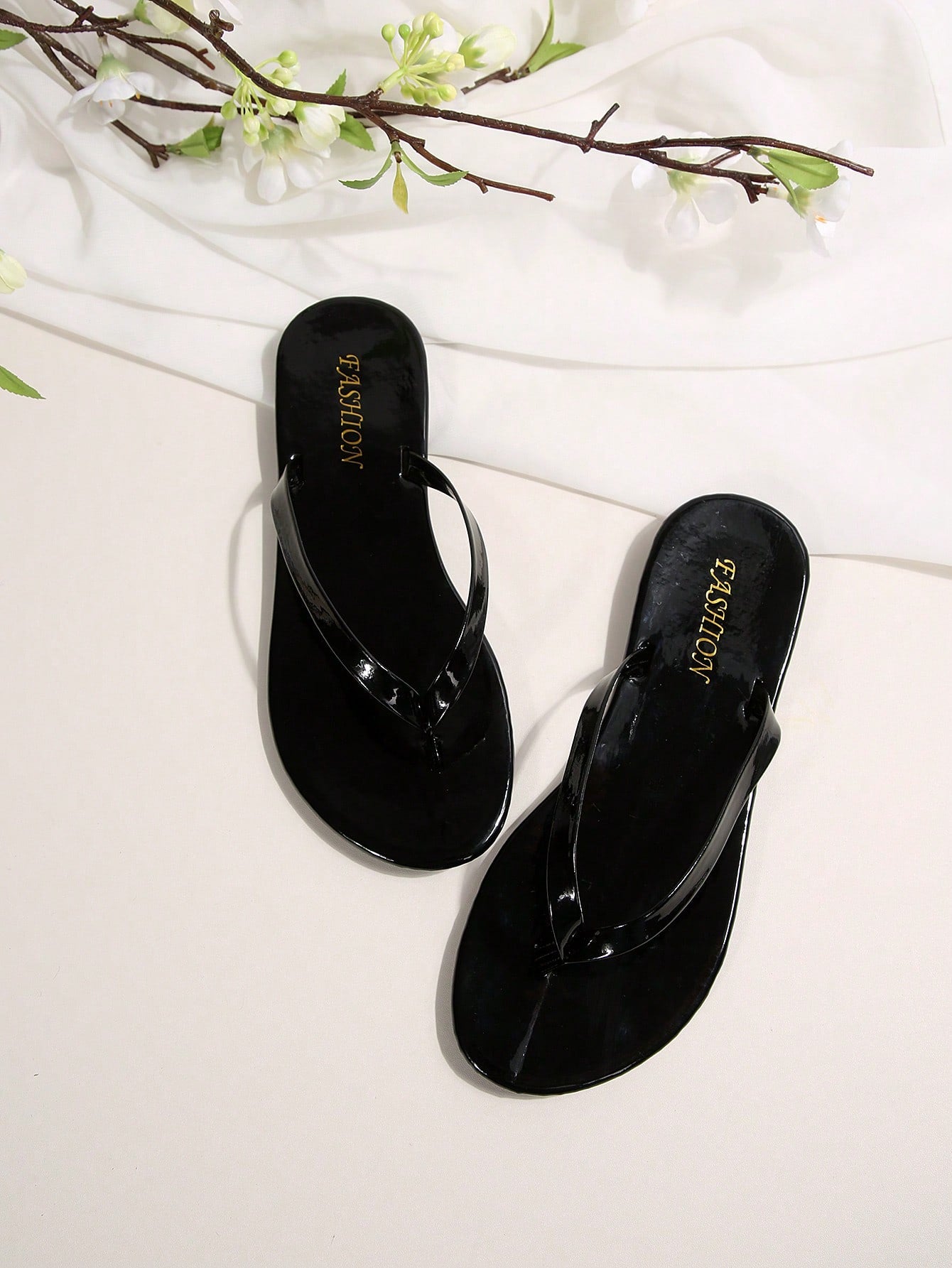 Women's chocolate brown flat flip flop sandals featuring a toe-post thong style and braided detail, suitable for casual indoor and outdoor wear.