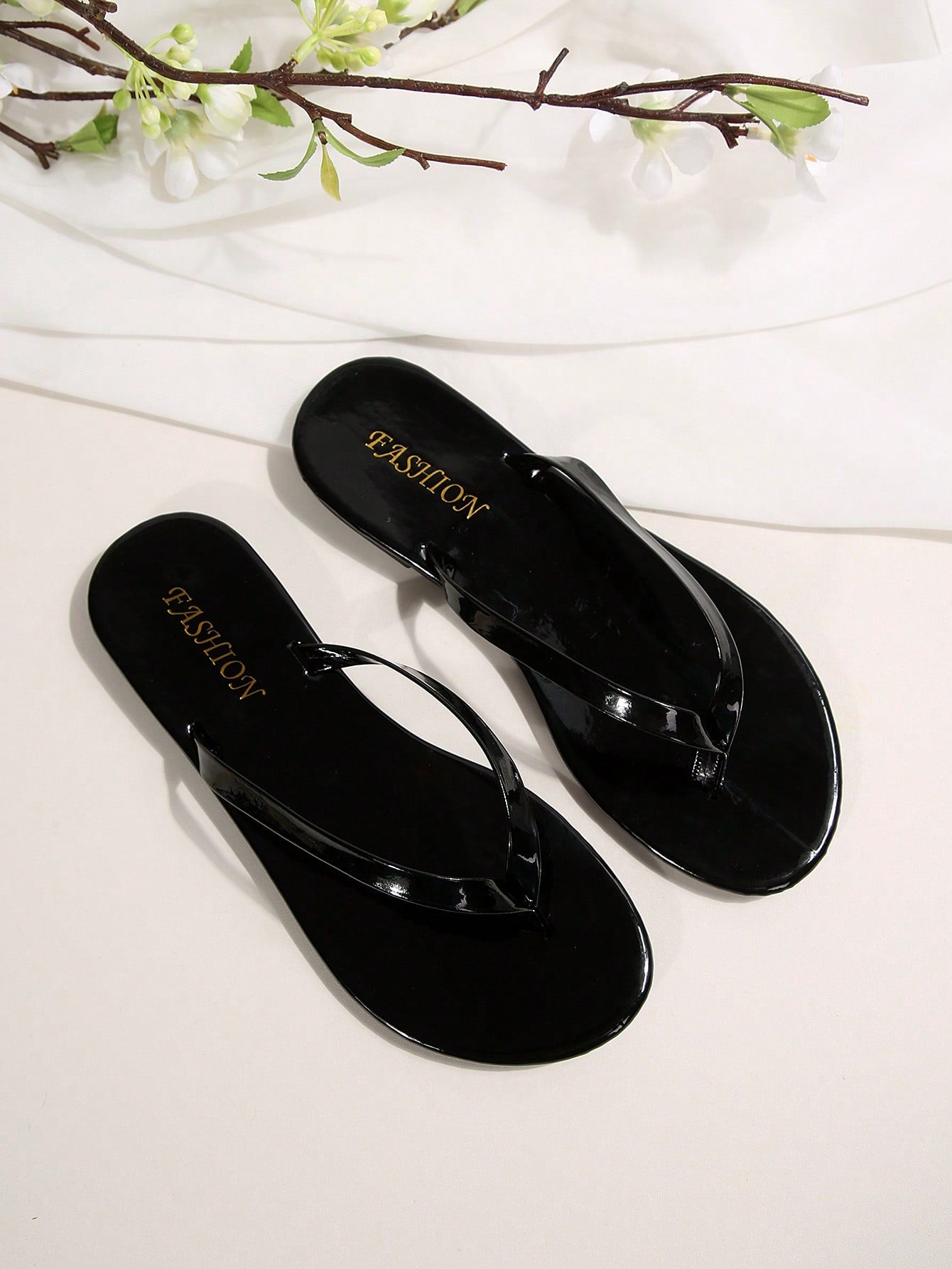 Women's chocolate brown flat flip flop sandals featuring a toe-post thong style and braided detail, suitable for casual indoor and outdoor wear.