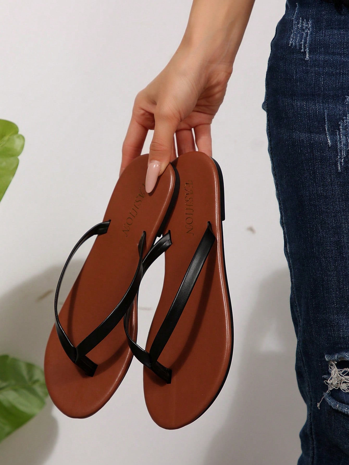 Women's chocolate brown flat flip flop sandals featuring a toe-post thong style and braided detail, suitable for casual indoor and outdoor wear.