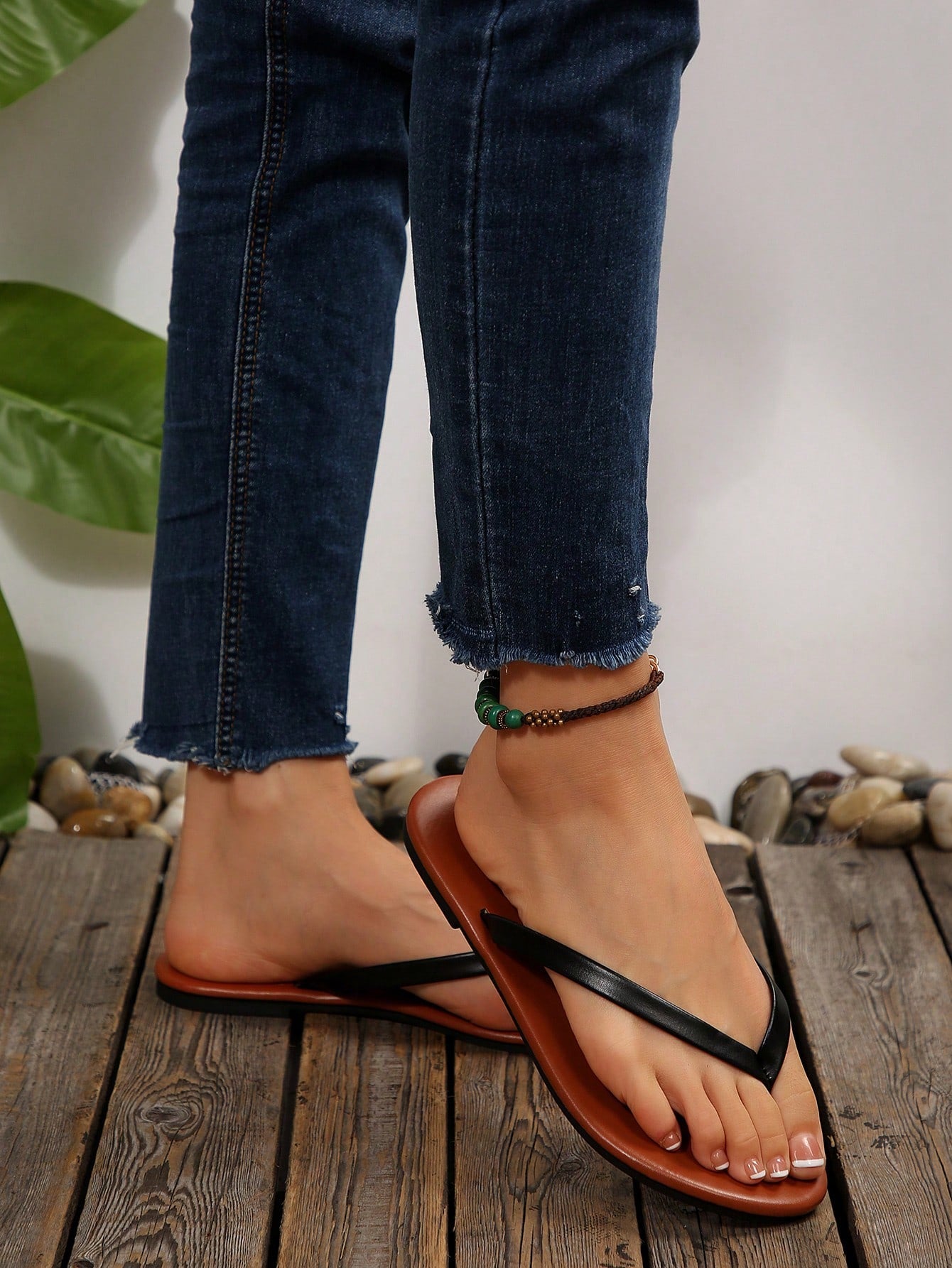 Women's chocolate brown flat flip flop sandals featuring a toe-post thong style and braided detail, suitable for casual indoor and outdoor wear.
