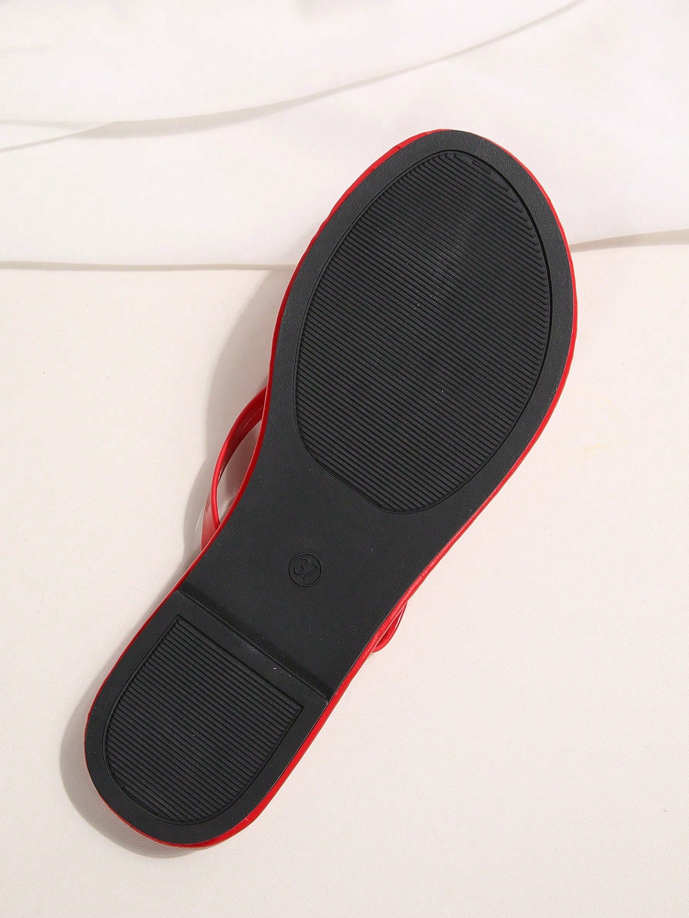 Women's chocolate brown flat flip flop sandals featuring a toe-post thong style and braided detail, suitable for casual indoor and outdoor wear.