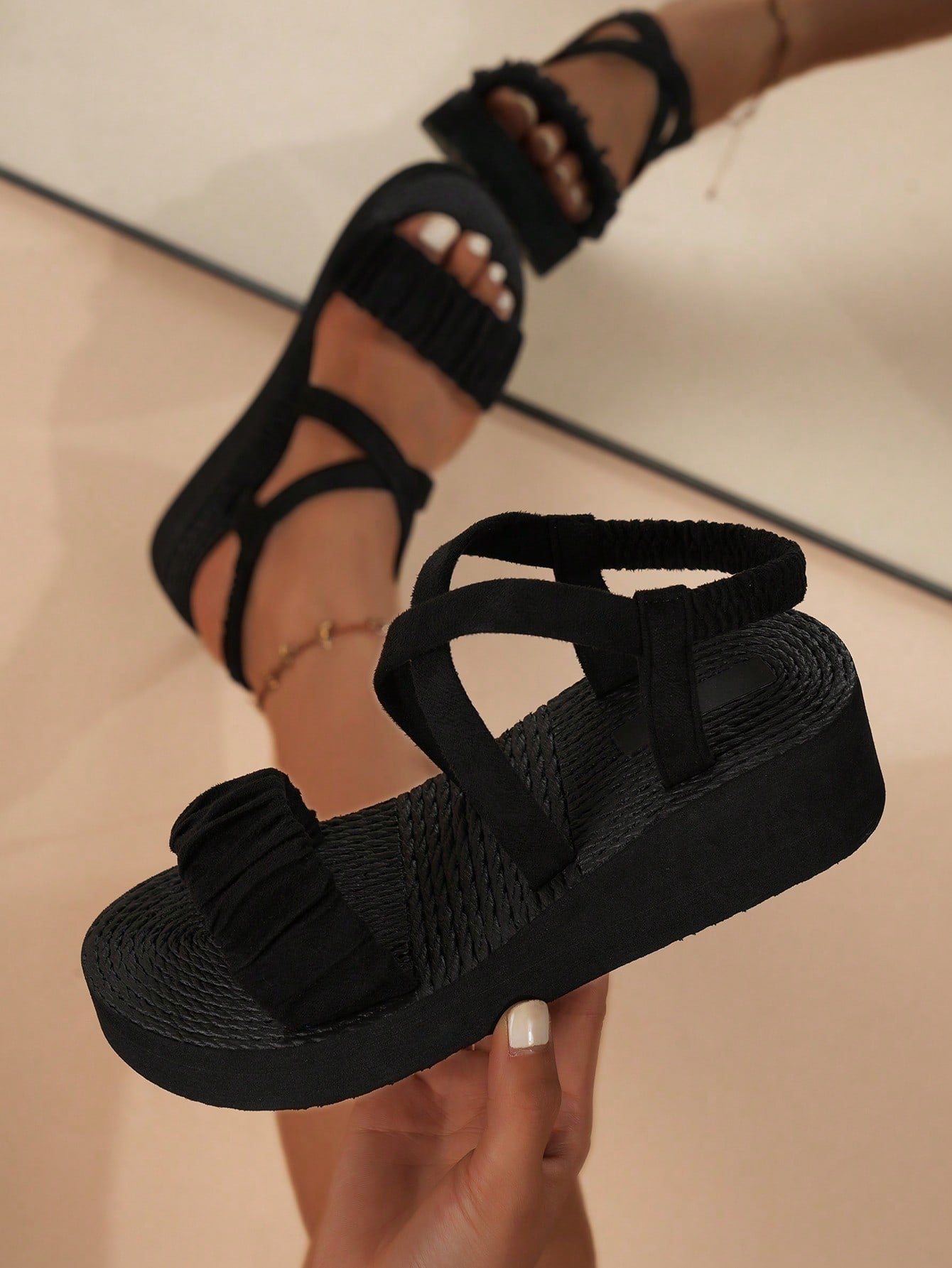 Women's black open-toe slip-on wedge sandals with crisscross back straps and ruched knot-style strap detail, designed in a casual lightweight vacation and street style.