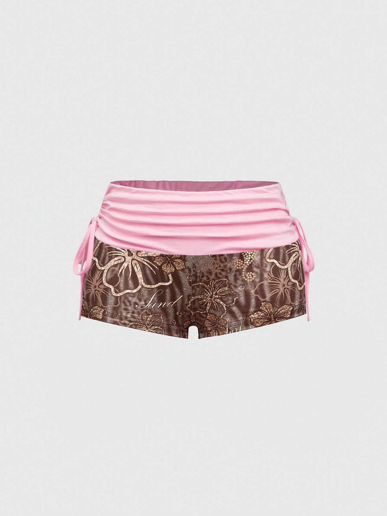 Women's low waist mini track shorts with elastic waistband, drawstring knot, ruched details, and plant pattern in a Y2K boho style