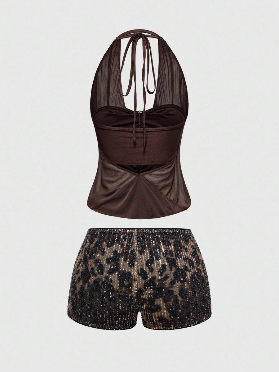 Women's two-piece outfit with a sleeveless halter cowl neck backless crop camisole, tie-back detail, bandeau inner, and leopard print shorts.
