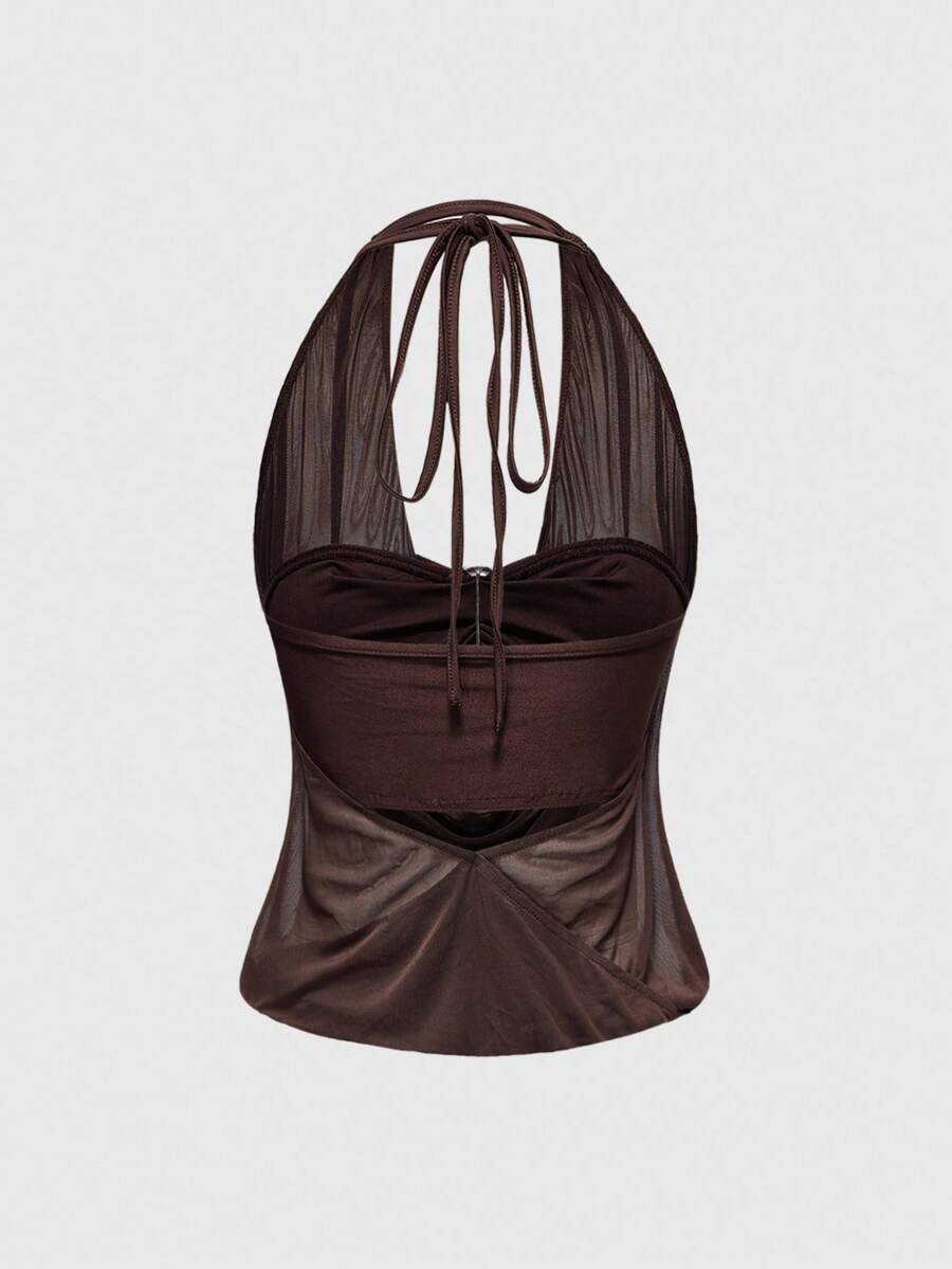 Women's two-piece outfit with a sleeveless halter cowl neck backless crop camisole, tie-back detail, bandeau inner, and leopard print shorts.