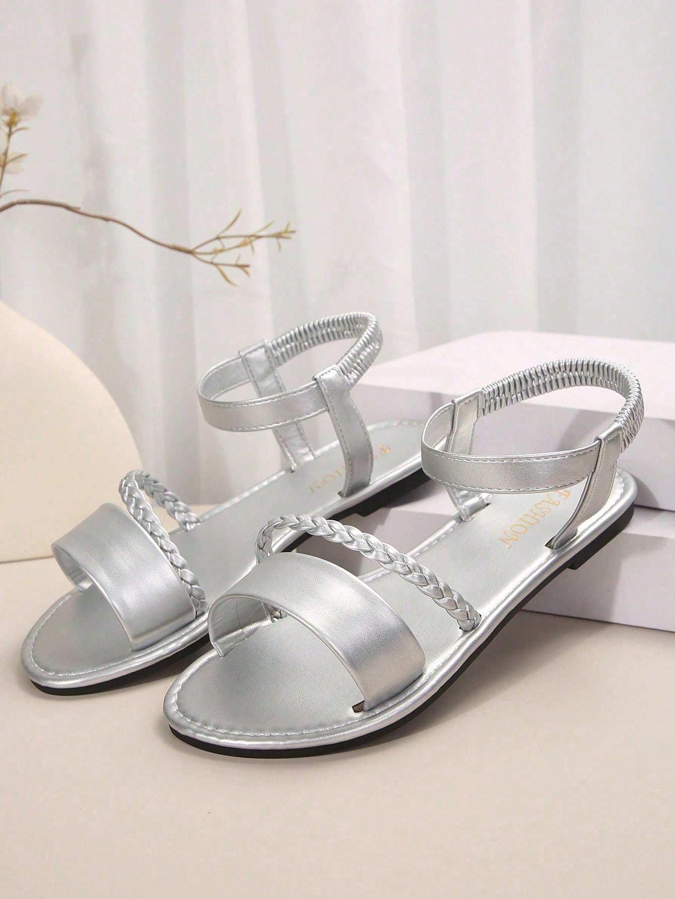 Women's plus size flat slide sandals with woven braid detail, open toe design, and elastic band strap, suitable for casual outdoor, beach, and vacation wear.