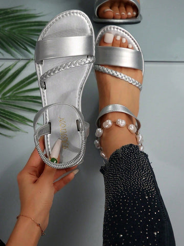 Women's plus size flat slide sandals with woven braid detail, open toe design, and elastic band strap, suitable for casual outdoor, beach, and vacation wear.