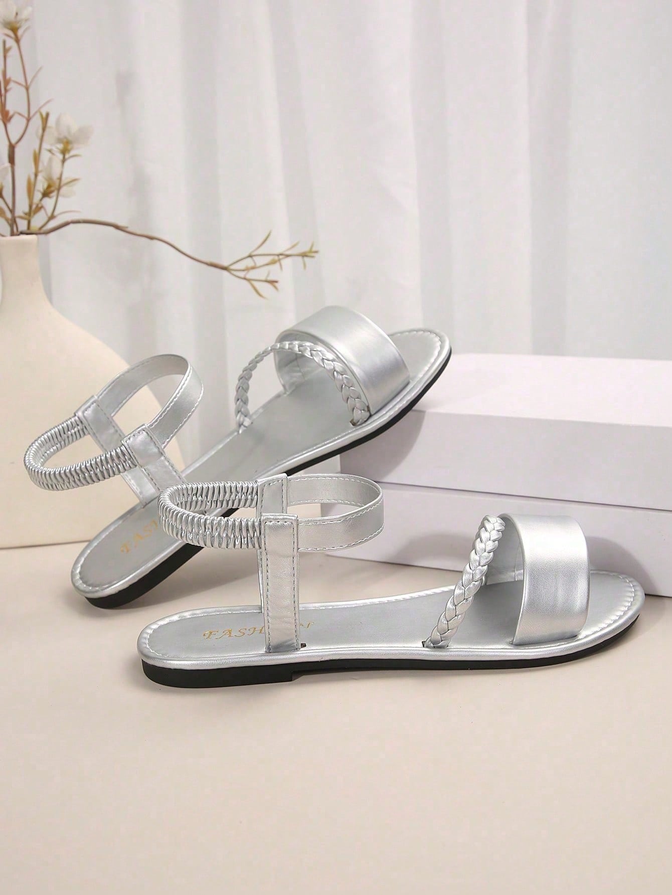 Women's plus size flat slide sandals with woven braid detail, open toe design, and elastic band strap, suitable for casual outdoor, beach, and vacation wear.