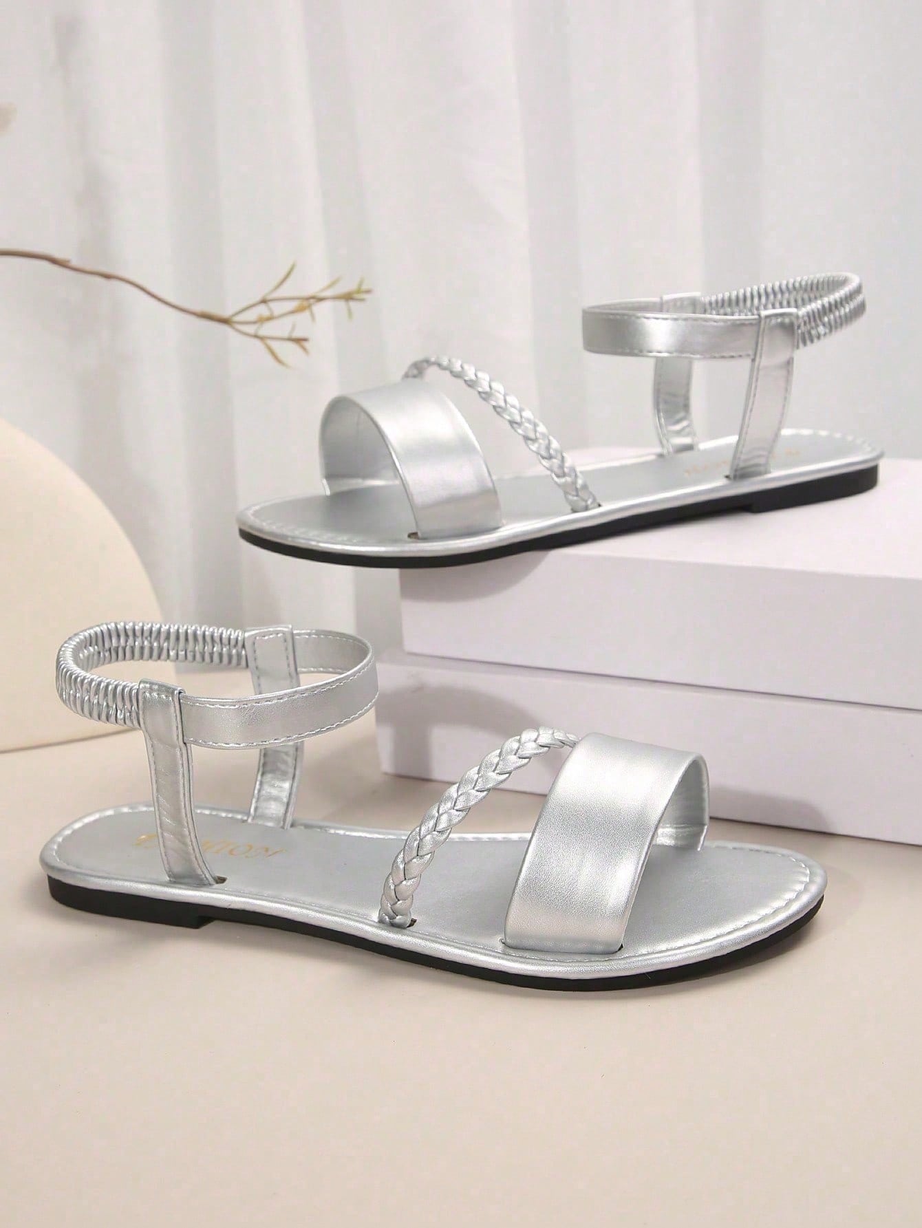 Women's plus size flat slide sandals with woven braid detail, open toe design, and elastic band strap, suitable for casual outdoor, beach, and vacation wear.