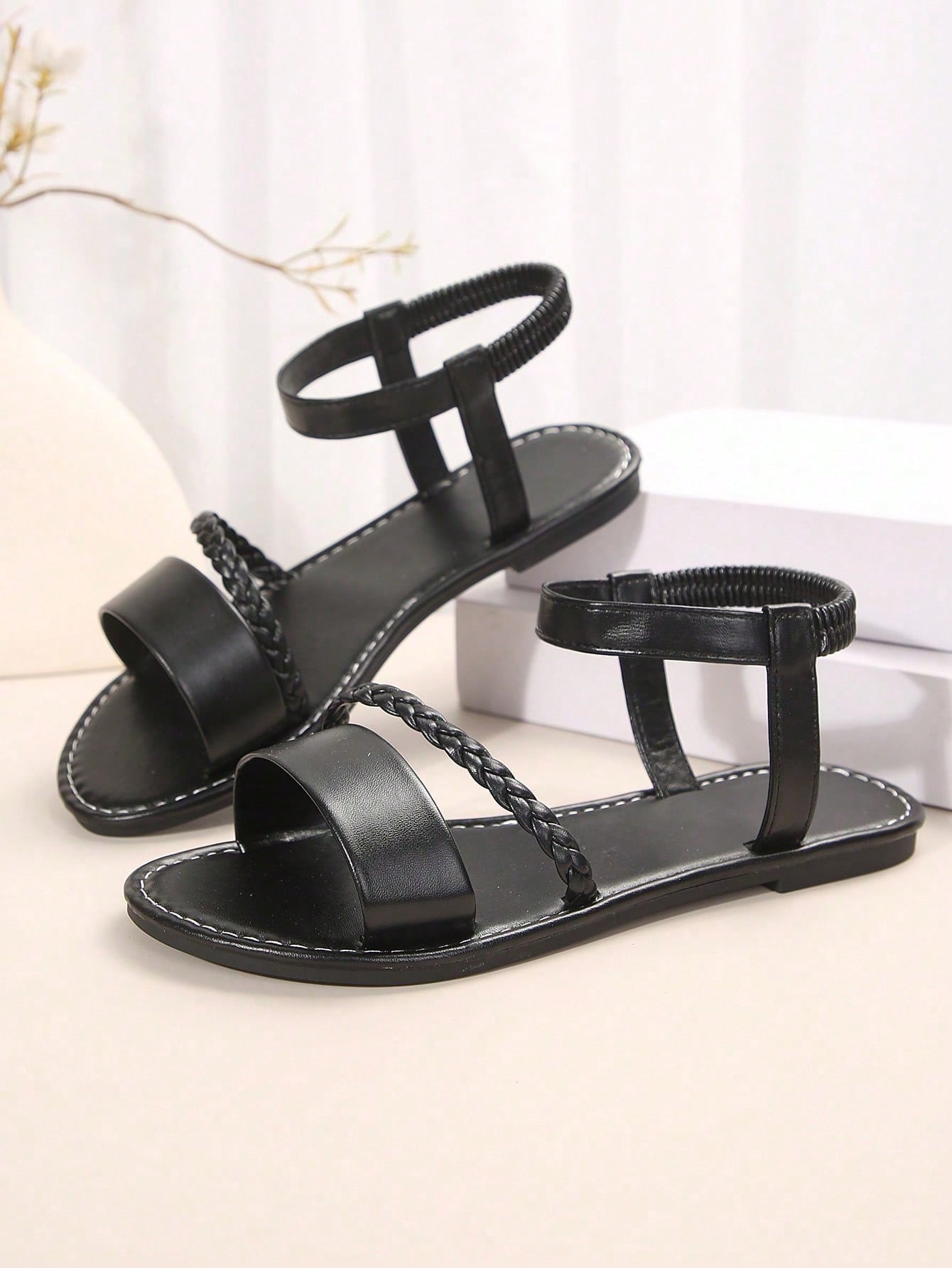 Women's plus size flat slide sandals with woven braid detail, open toe design, and elastic band strap, suitable for casual outdoor, beach, and vacation wear.
