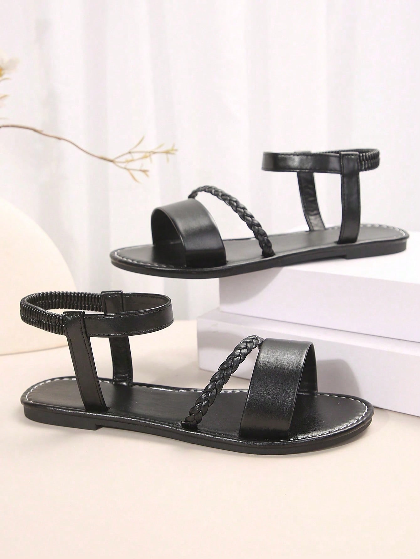 Women's plus size flat slide sandals with woven braid detail, open toe design, and elastic band strap, suitable for casual outdoor, beach, and vacation wear.