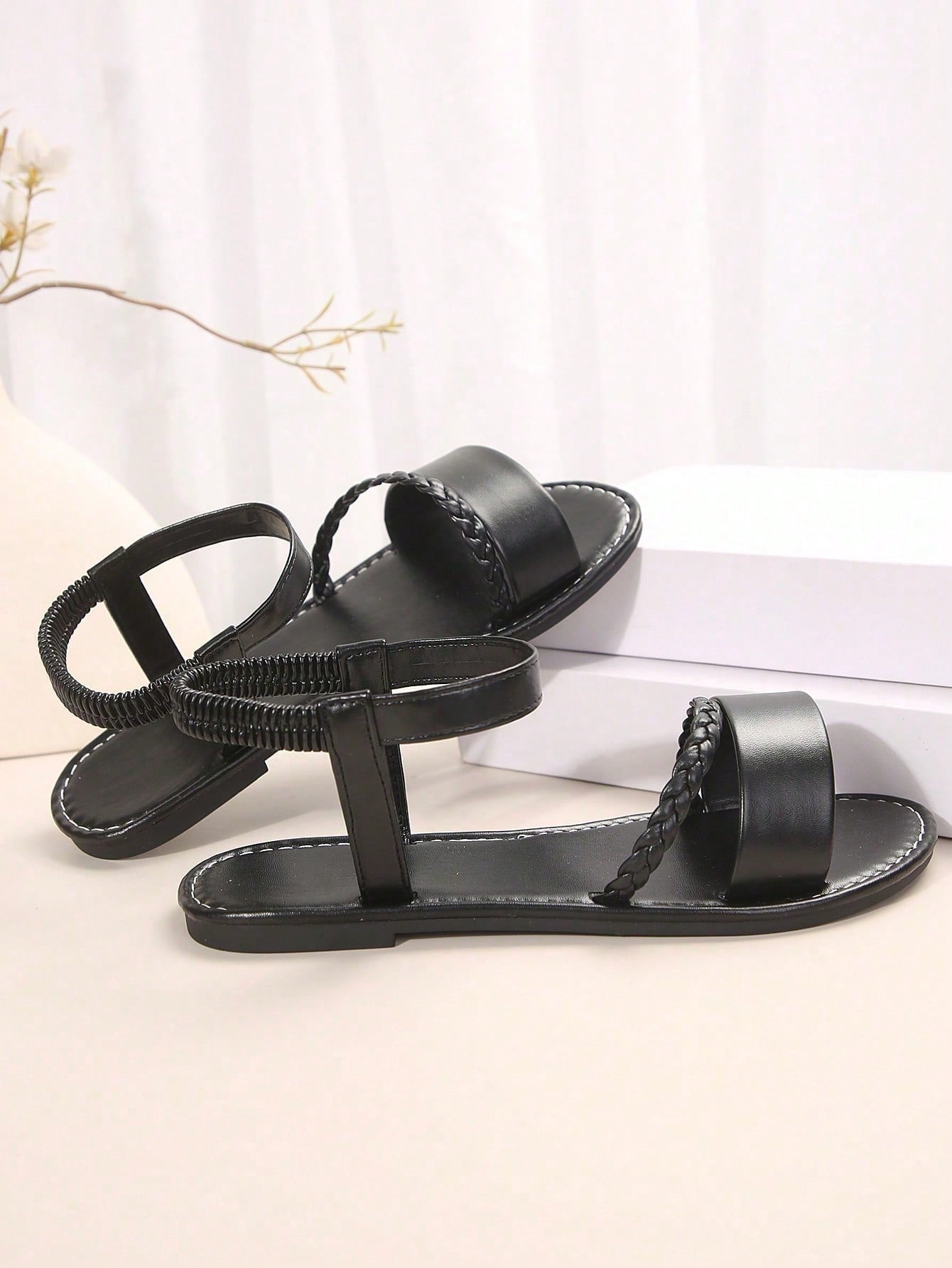 Women's plus size flat slide sandals with woven braid detail, open toe design, and elastic band strap, suitable for casual outdoor, beach, and vacation wear.
