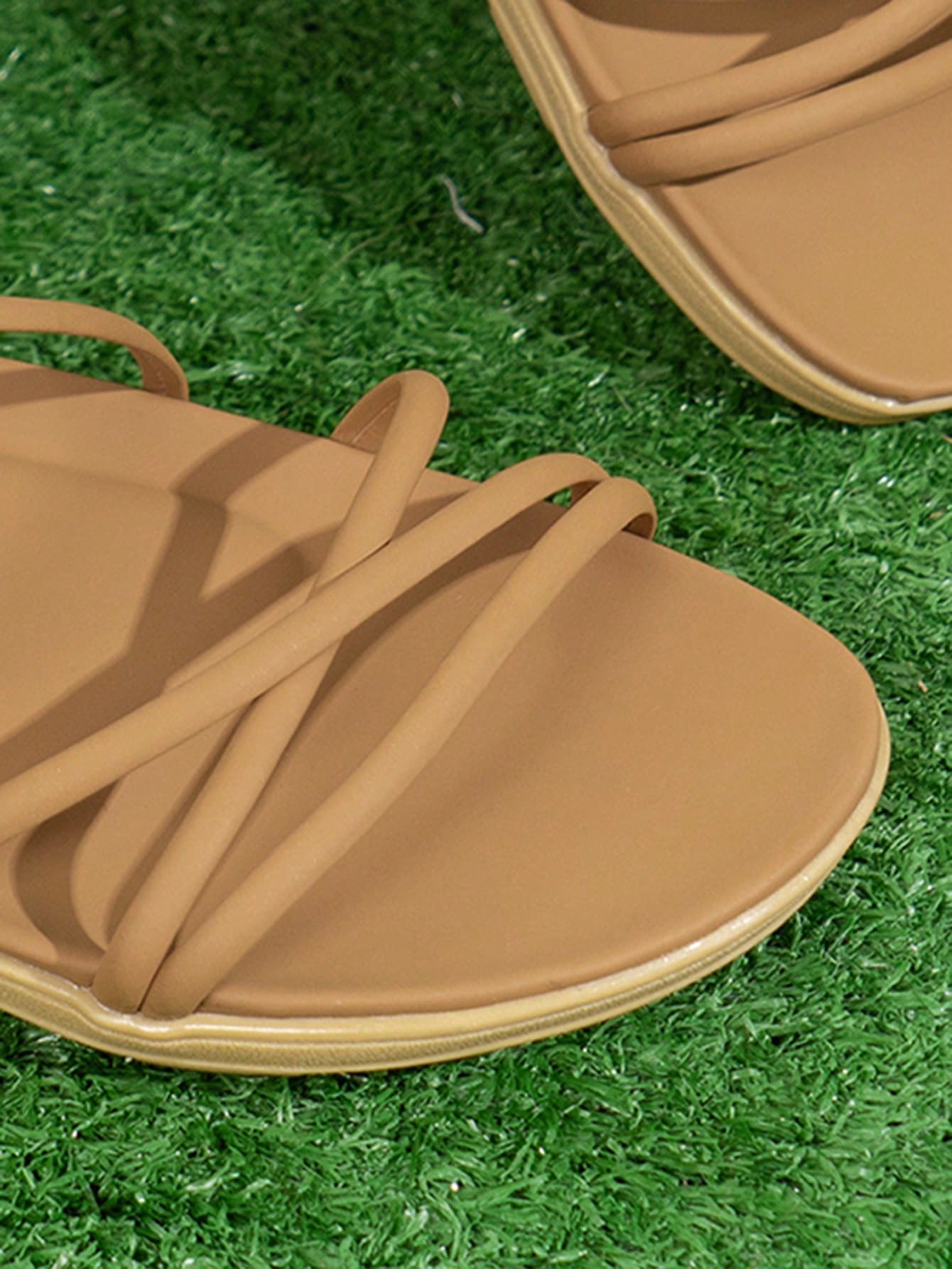 Women's khaki criss cross flat sandals with ankle strap and open toe design