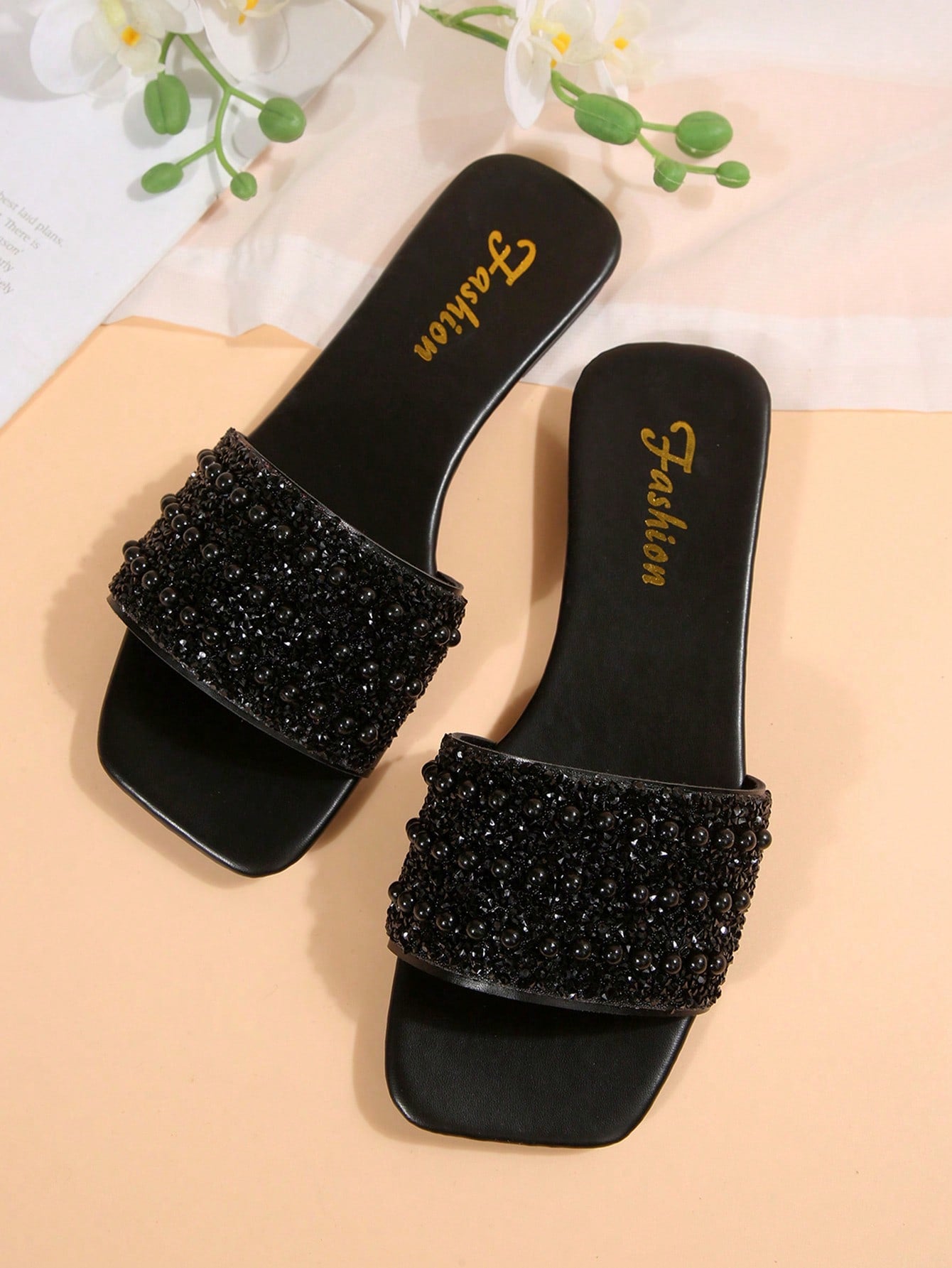 Women's flat slide sandals with rhinestone-decorated straps and open toe, casual outdoor style with plain design.