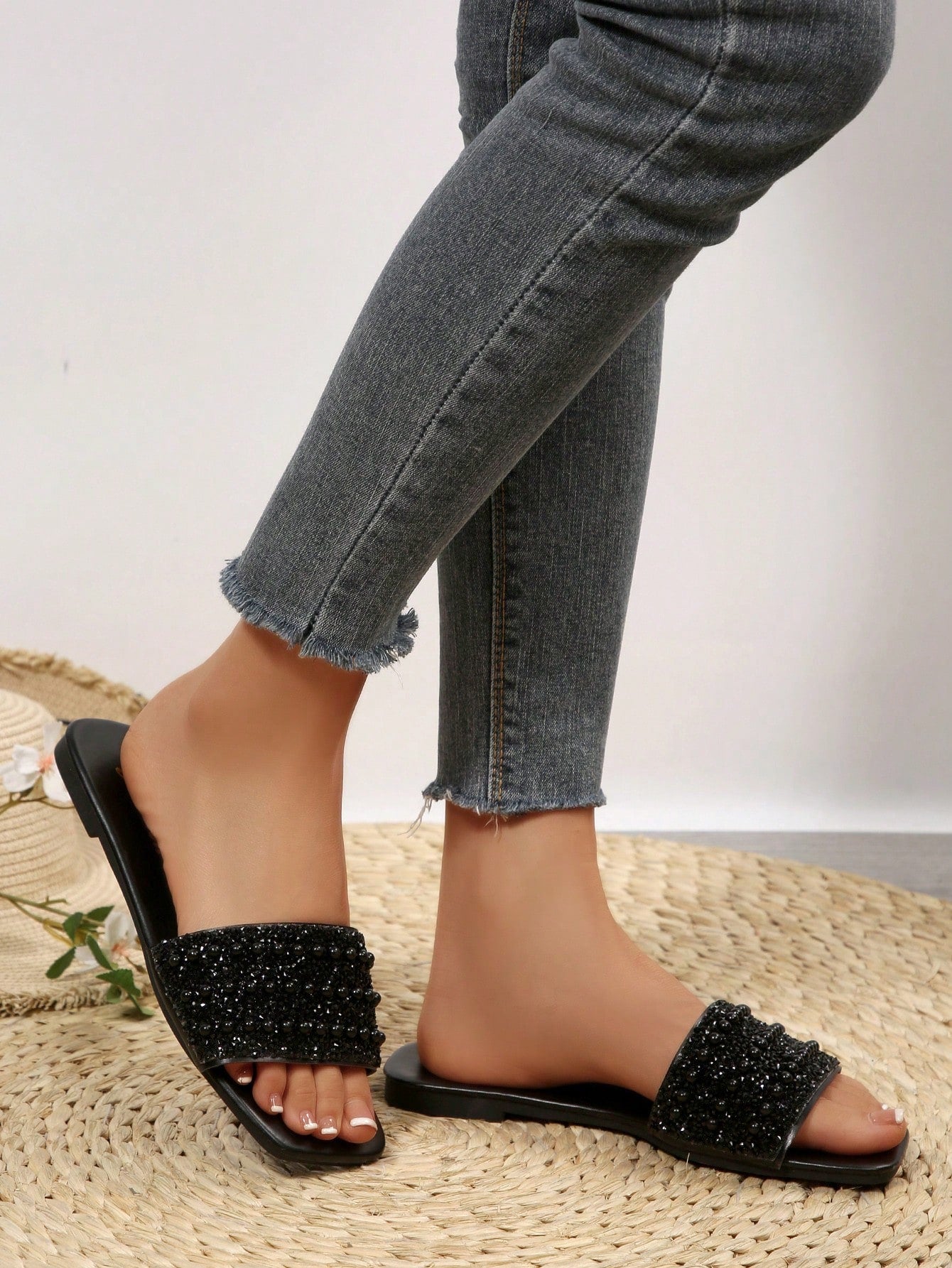 Women's flat slide sandals with rhinestone-decorated straps and open toe, casual outdoor style with plain design.