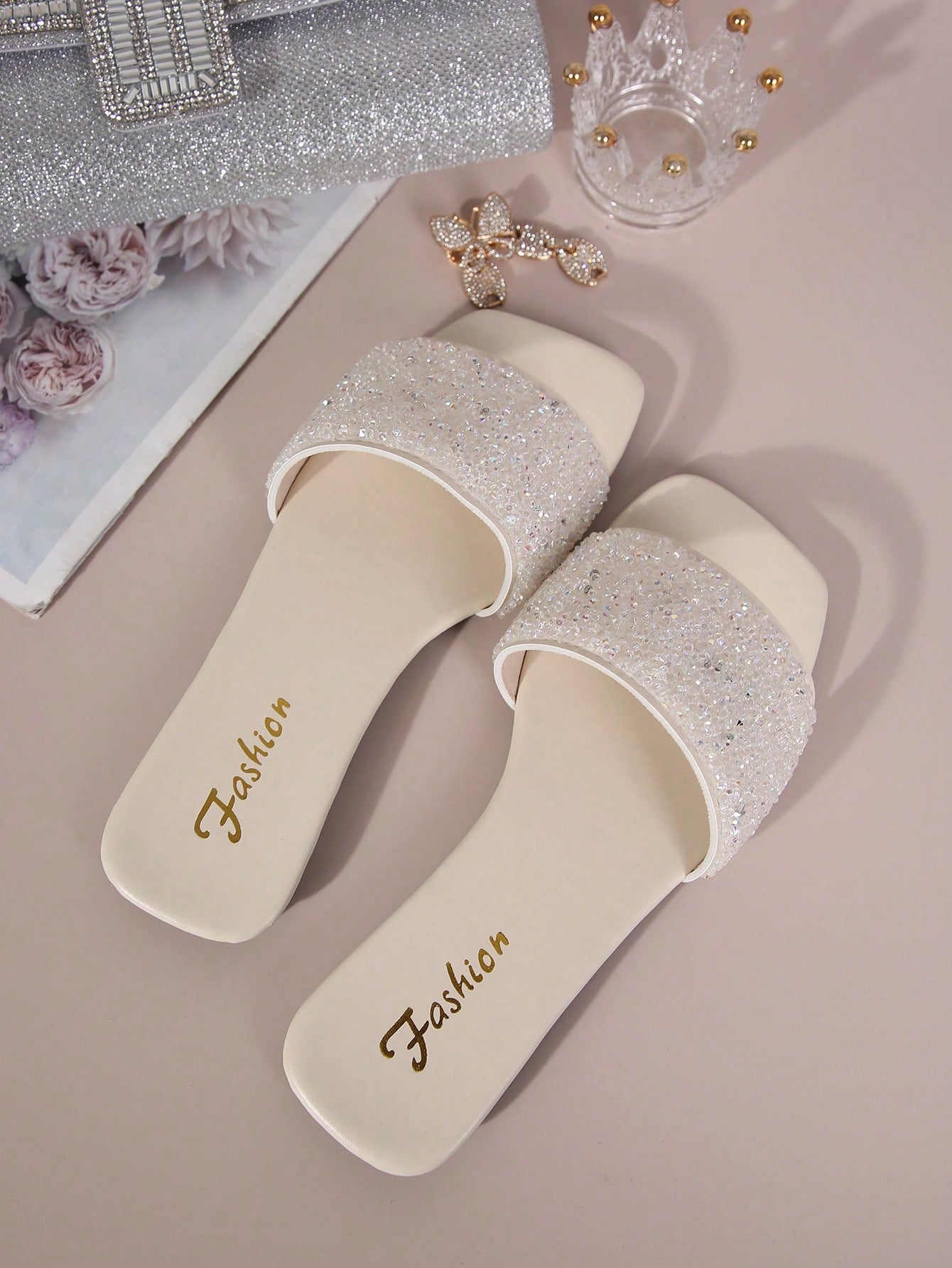 Black plus size women's slip-on flat slide sandals with square open toe, soft non-slip sole, and pearl rhinestone embellishments.
