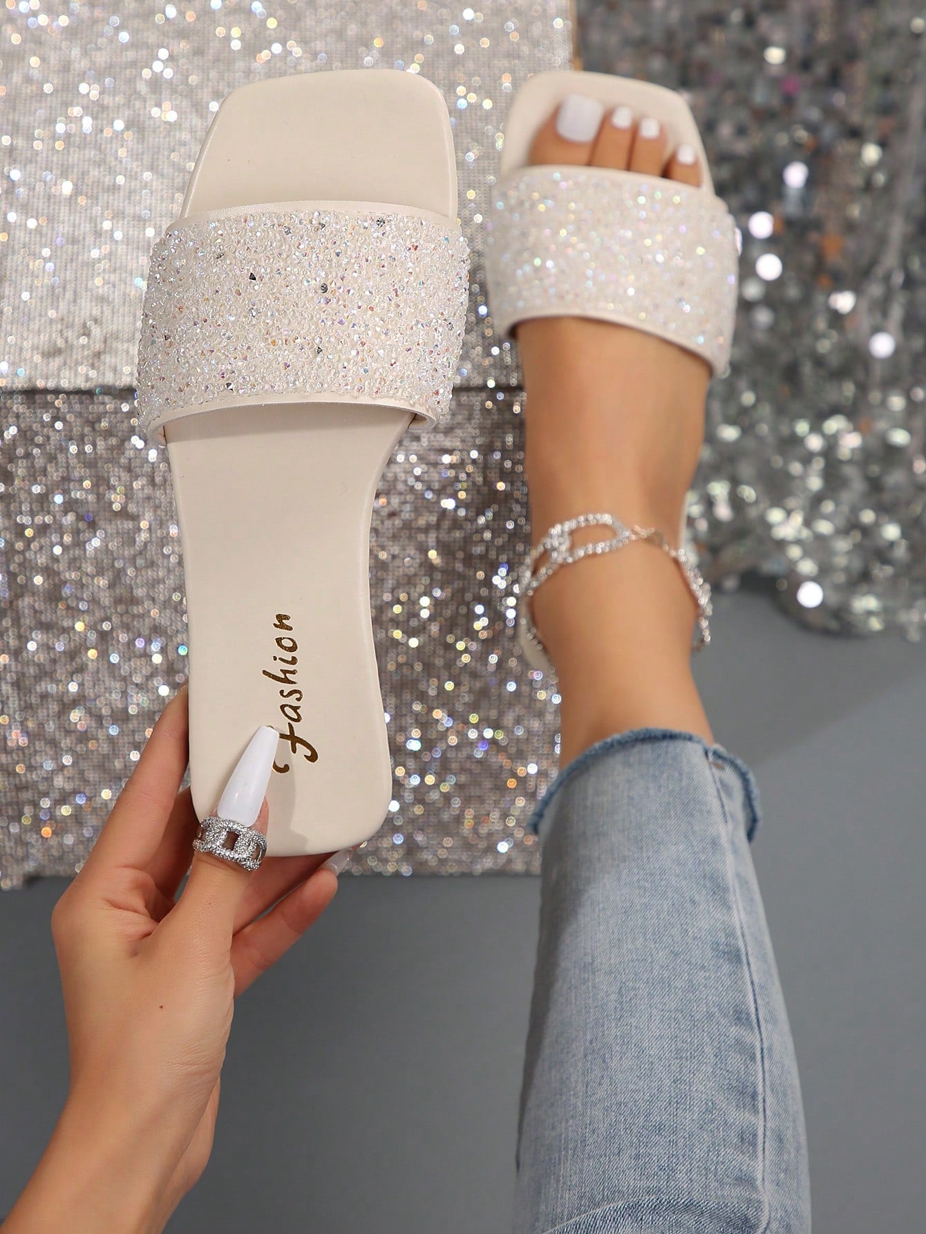 Black plus size women's slip-on flat slide sandals with square open toe, soft non-slip sole, and pearl rhinestone embellishments.