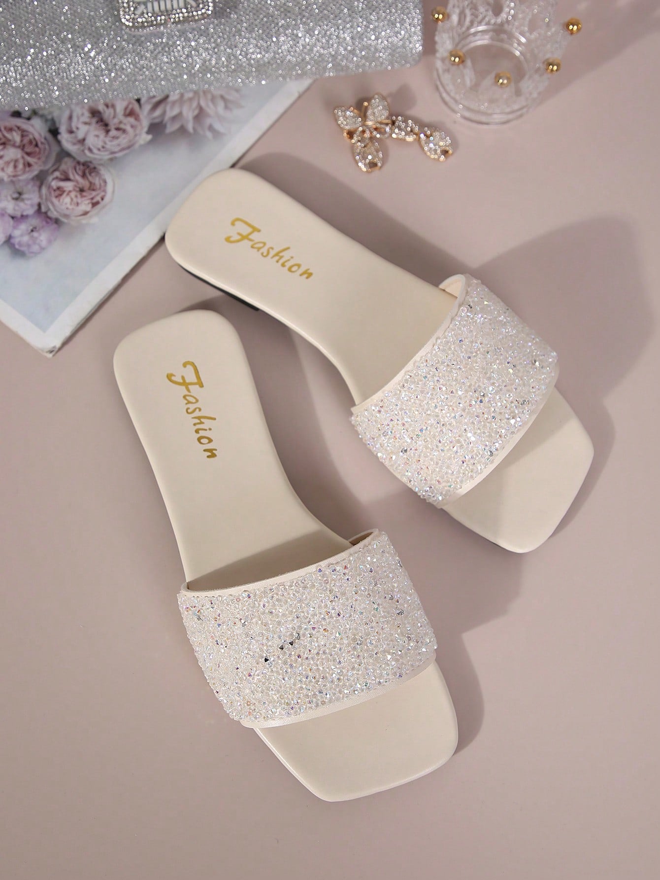 Black plus size women's slip-on flat slide sandals with square open toe, soft non-slip sole, and pearl rhinestone embellishments.