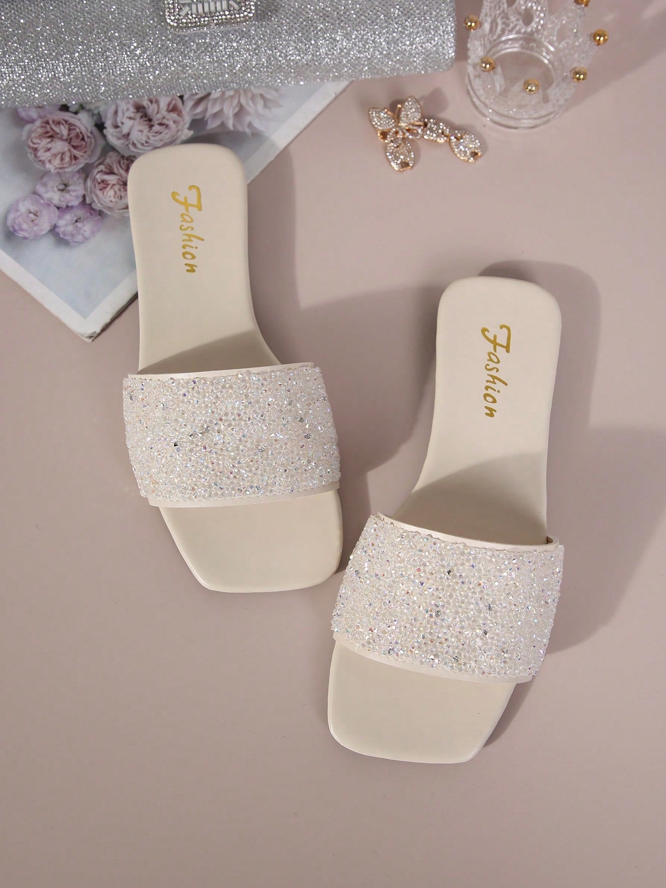 Black plus size women's slip-on flat slide sandals with square open toe, soft non-slip sole, and pearl rhinestone embellishments.