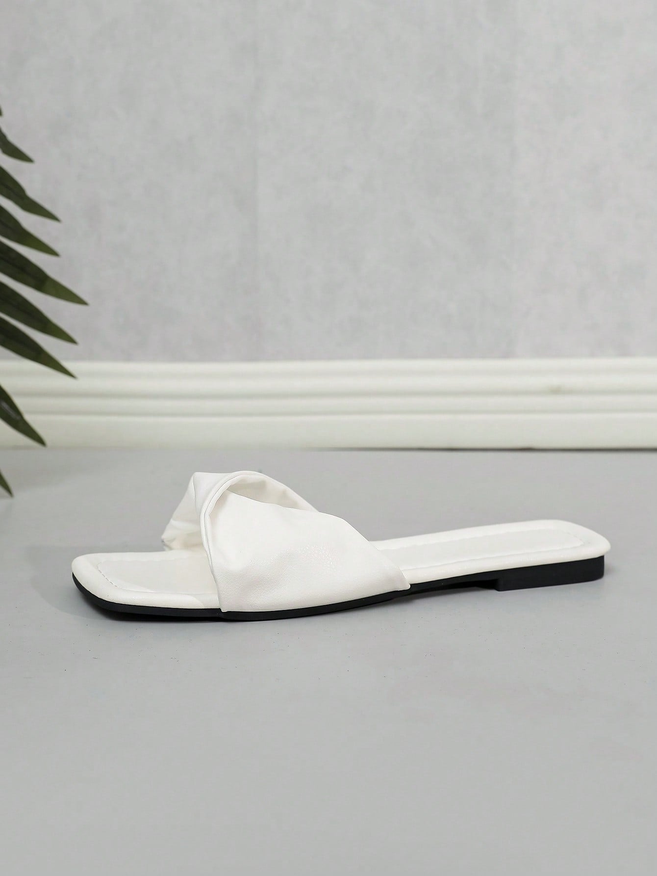 Women's white flat thong slide sandals with open square toe and twist detail, casual elegant style for home wear.