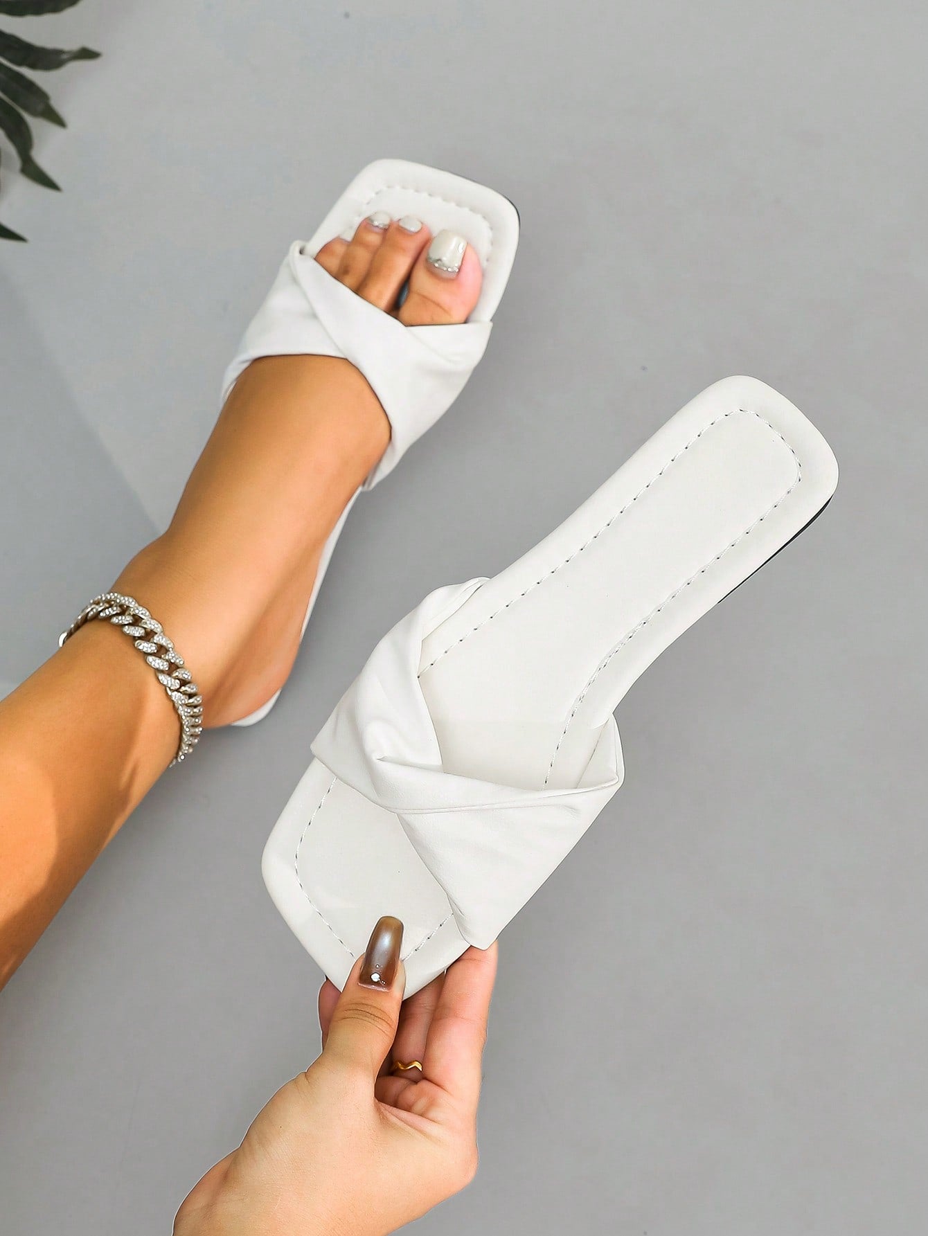 Women's white flat thong slide sandals with open square toe and twist detail, casual elegant style for home wear.