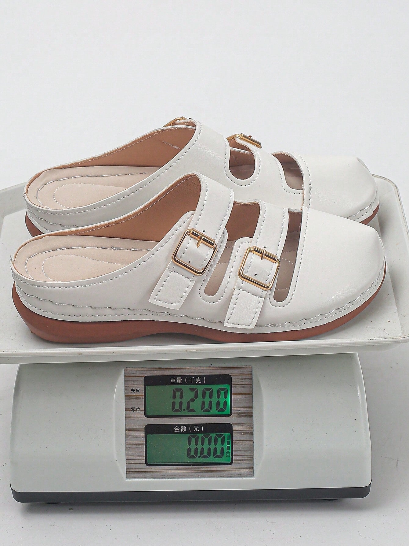 Women's bohemian wedge slide sandals with open toe, low wedge heel, slip-on design, and metal detail, available in plus sizes 36-43.