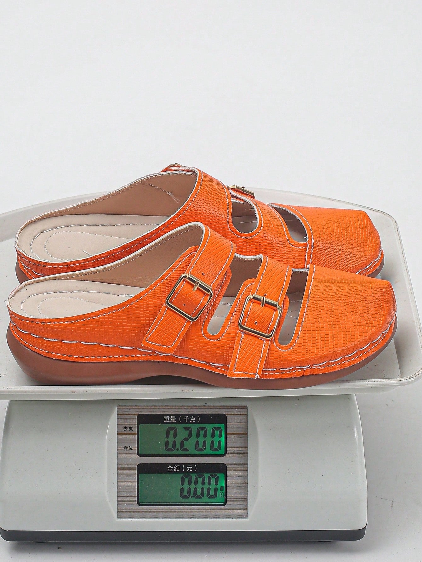 Women's bohemian wedge slide sandals with open toe, low wedge heel, slip-on design, and metal detail, available in plus sizes 36-43.