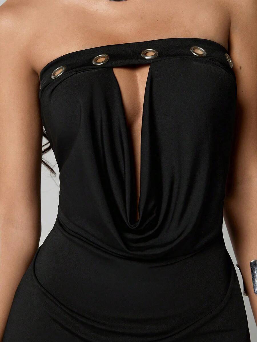 Strapless bodycon mini dress with grommet decor, ruched bust, hollow-out detailing, slim fit, and short pencil hem.